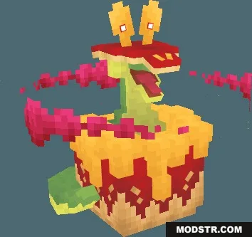 Giant green monster emerging from a red and yellow cake structure