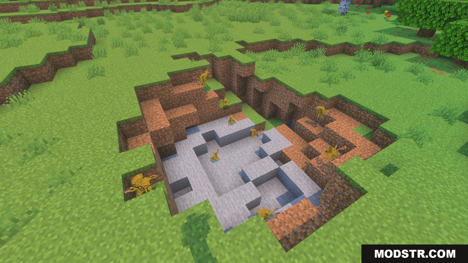 Small alien Grunts standing in a stone crater structure in the grass