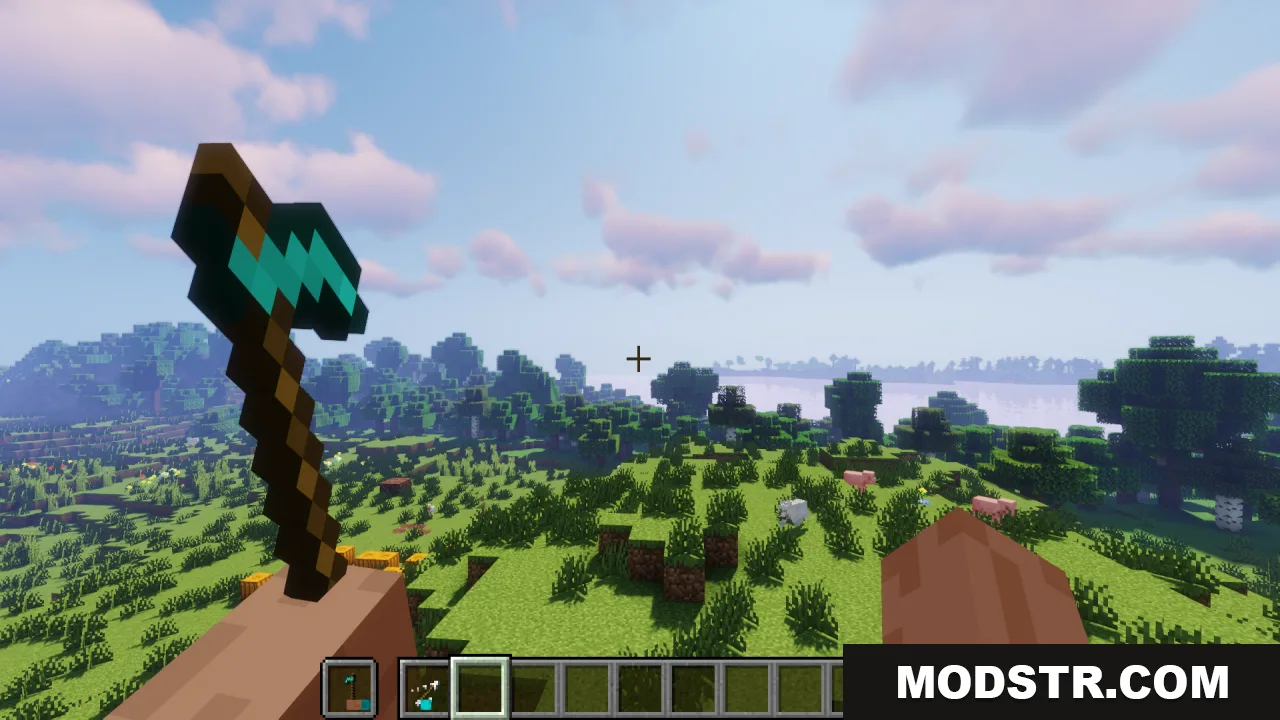 Hold in Hands Resource Pack Screenshot 7 Player holding a diamond hoe with visible hands in a grassy landscape