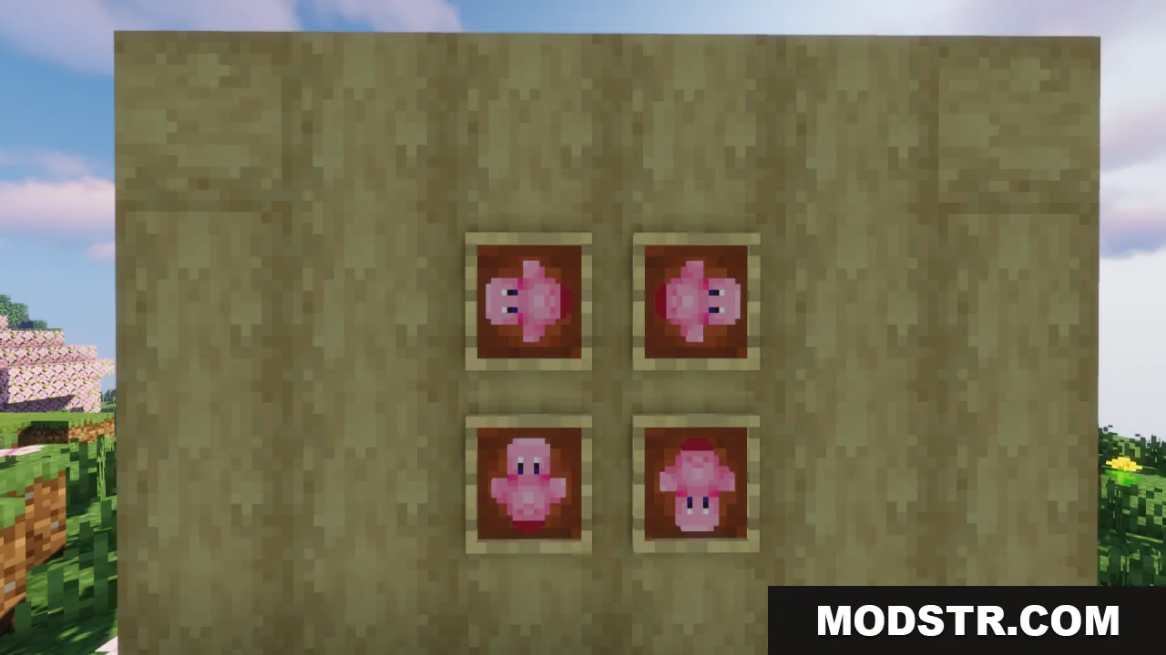 Four pink Kirby items displayed in item frames on a wooden wall