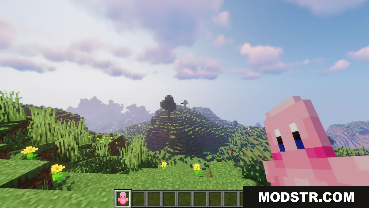 Player holding a pink Kirby Totem of Undying while looking at a hill