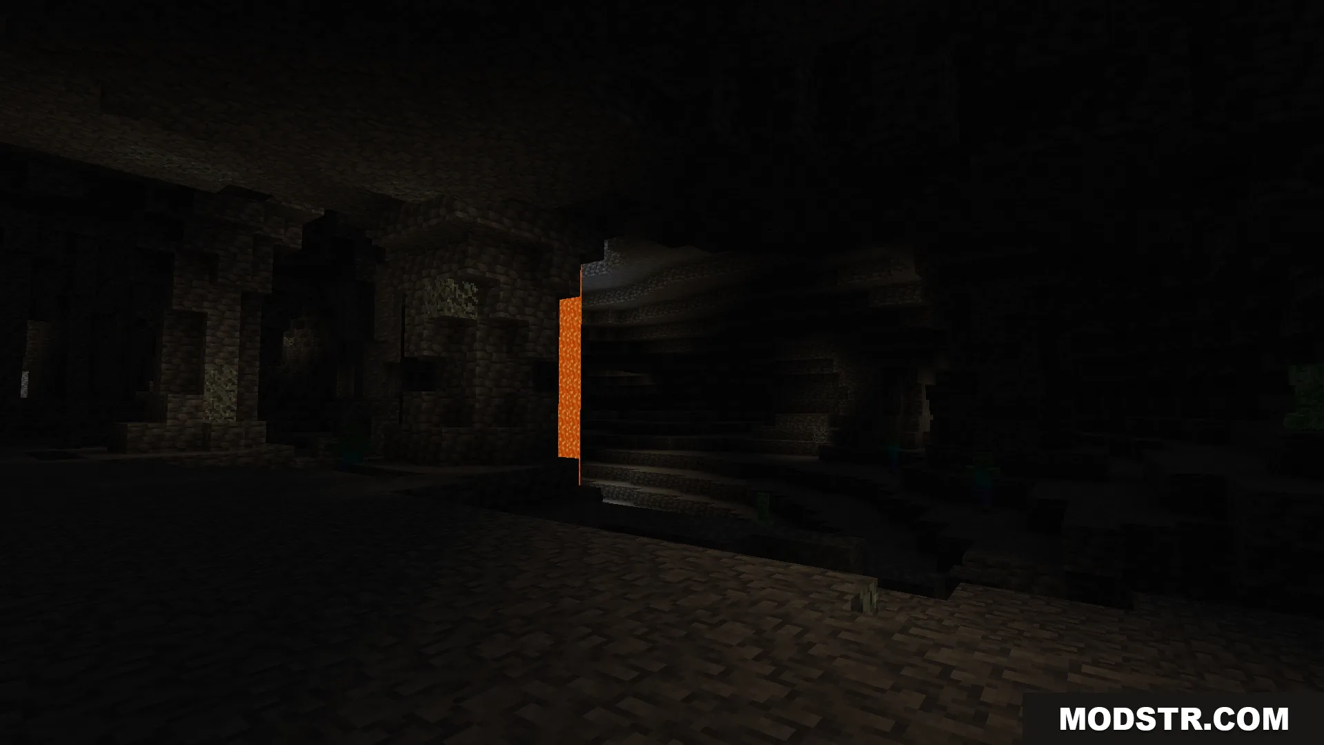 A dark underground cave with lava before the night vision is active
