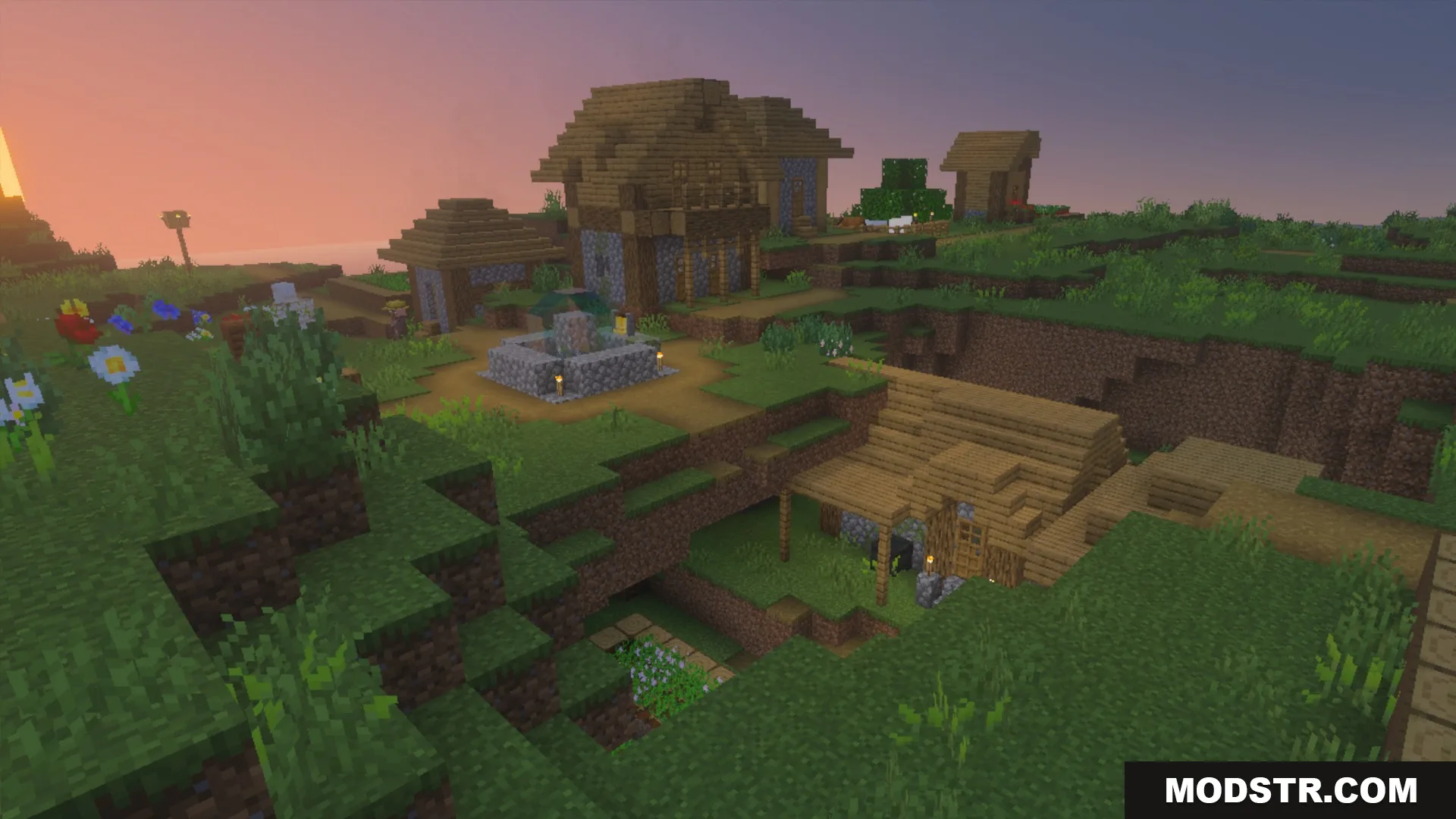 Wooden houses and a village fountain at sunset with the La Nature pack