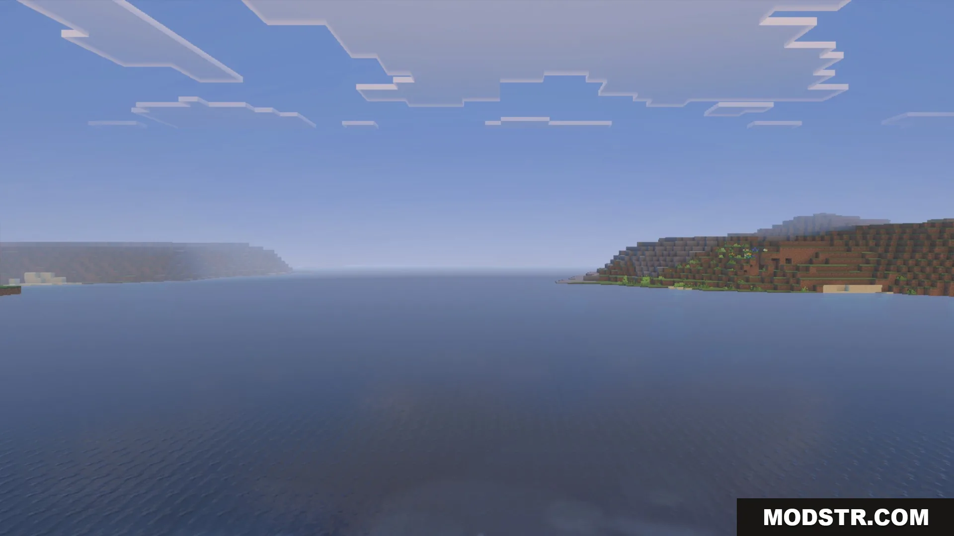 Daytime ocean water, clouds and shoreline with the La Nature pack