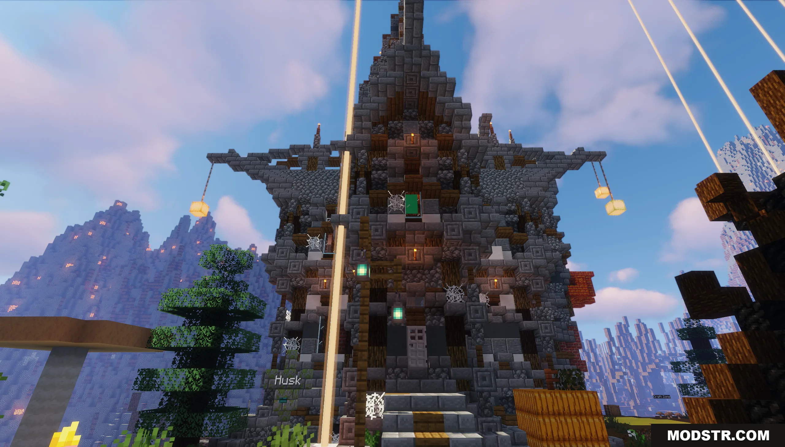 Logical Codes on the Island Map Screenshot 5 A large stone building with hanging lanterns and cobwebs in a mountain biome