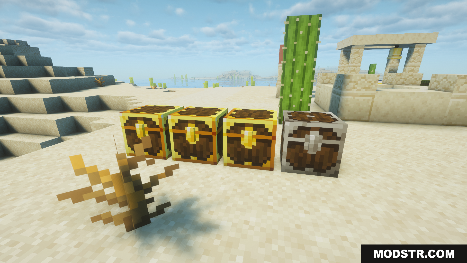 Three golden chests and one silver chest on sand