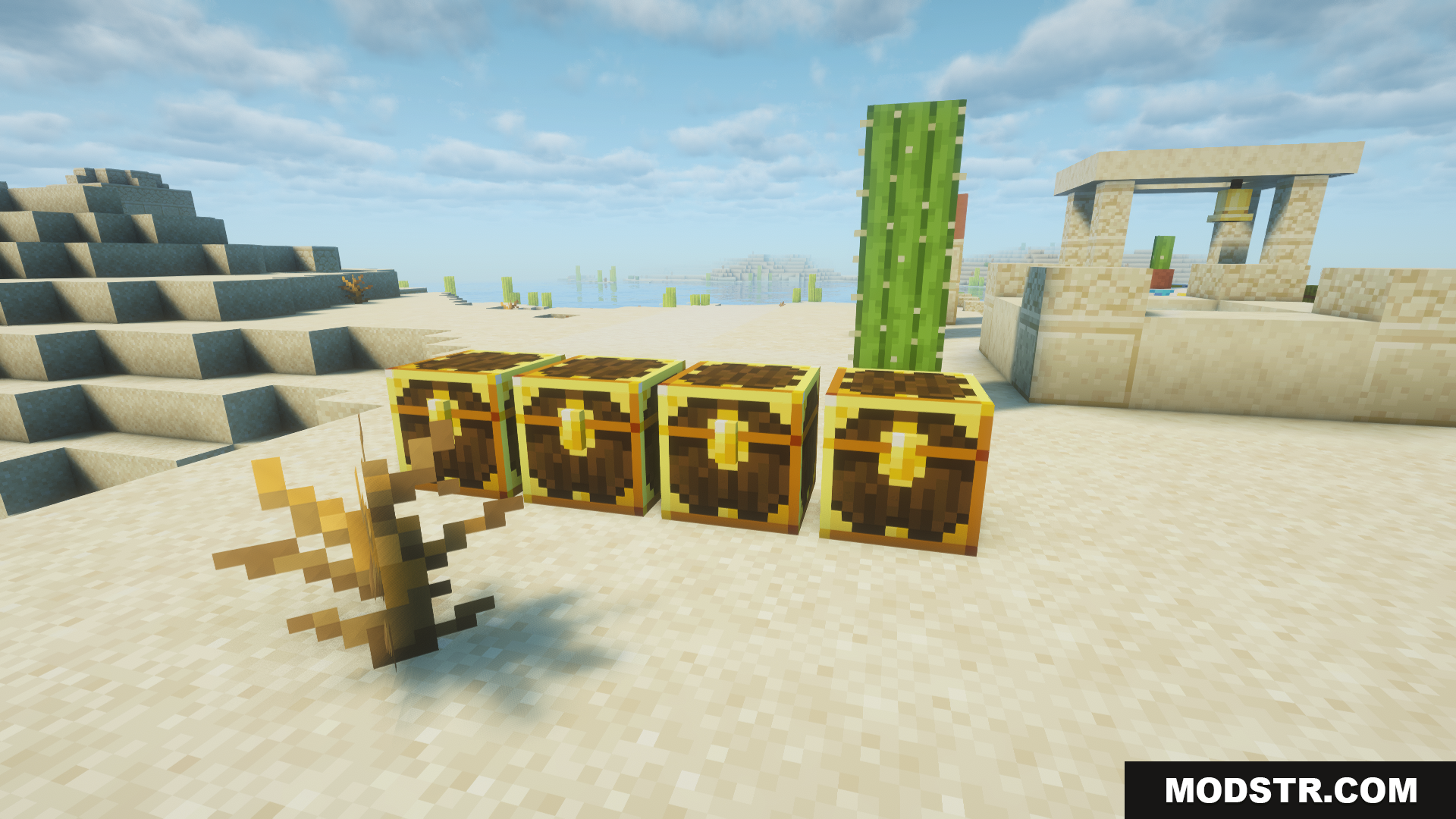 Four special golden loot chests lined up in the desert