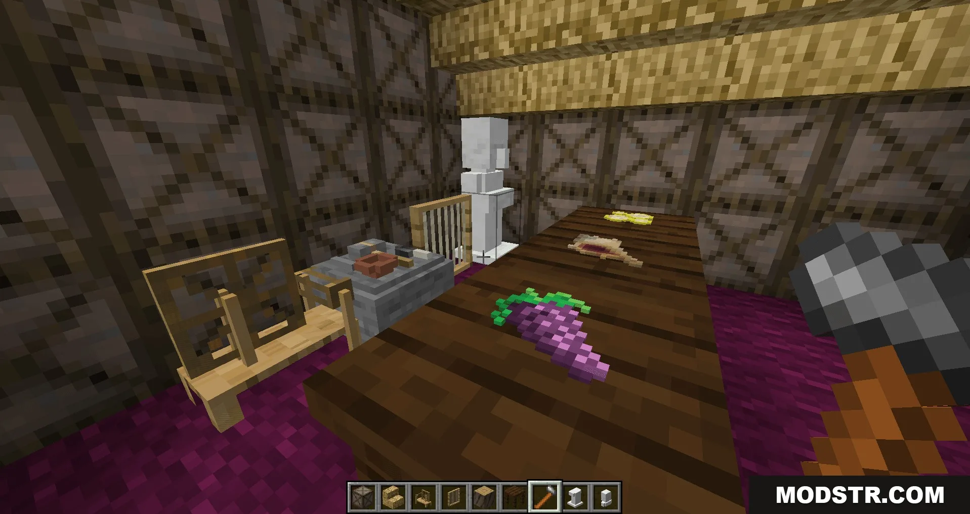 Player holding a hammer in a room with food and a statue