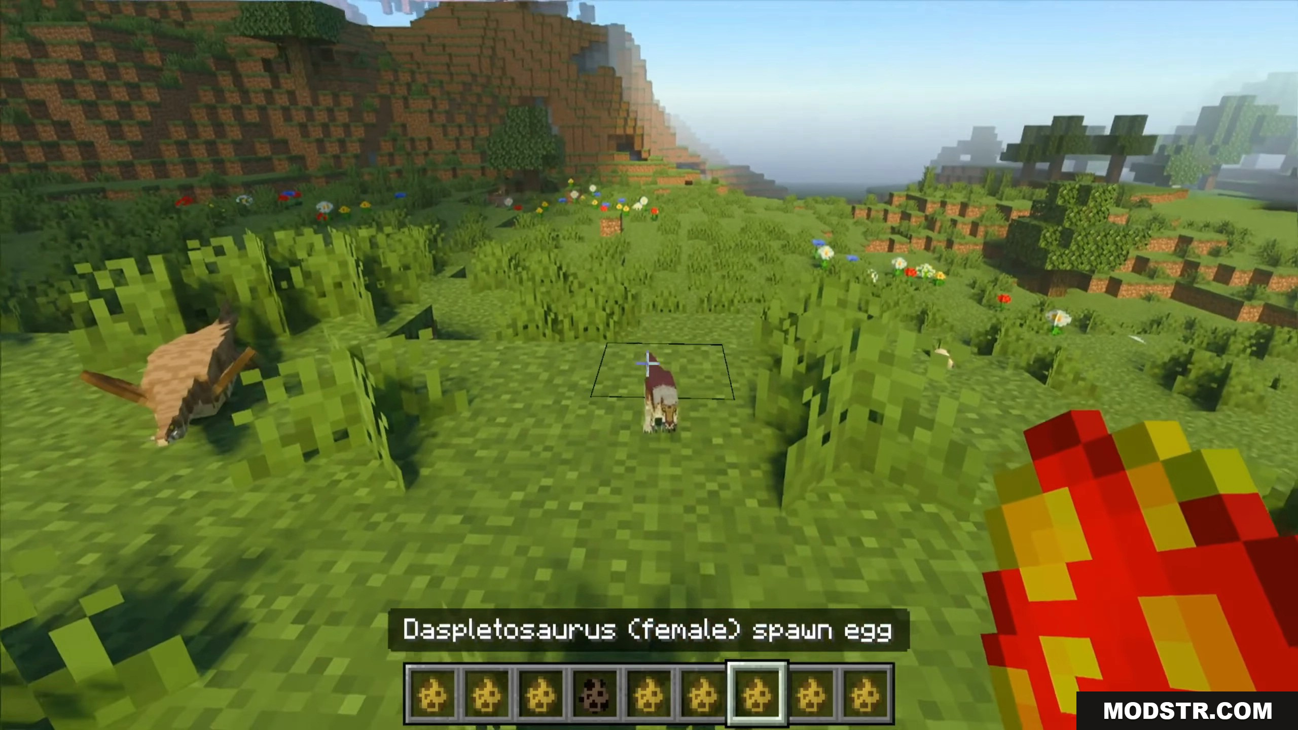 Mesozoic Biology Addon Screenshot 5 Player holding a spawn egg to hatch baby dinosaur species