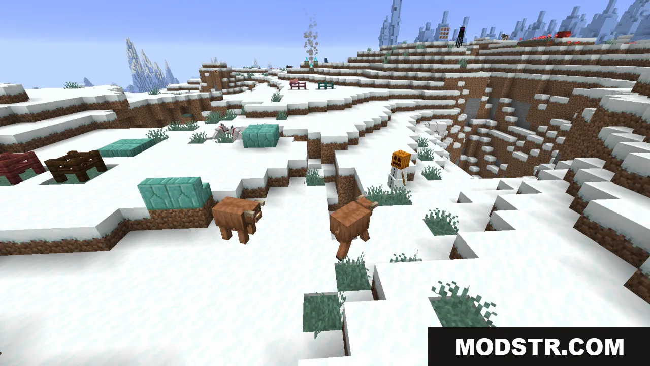 Two brown fluffy cows walking through a snowy landscape with a snow golem