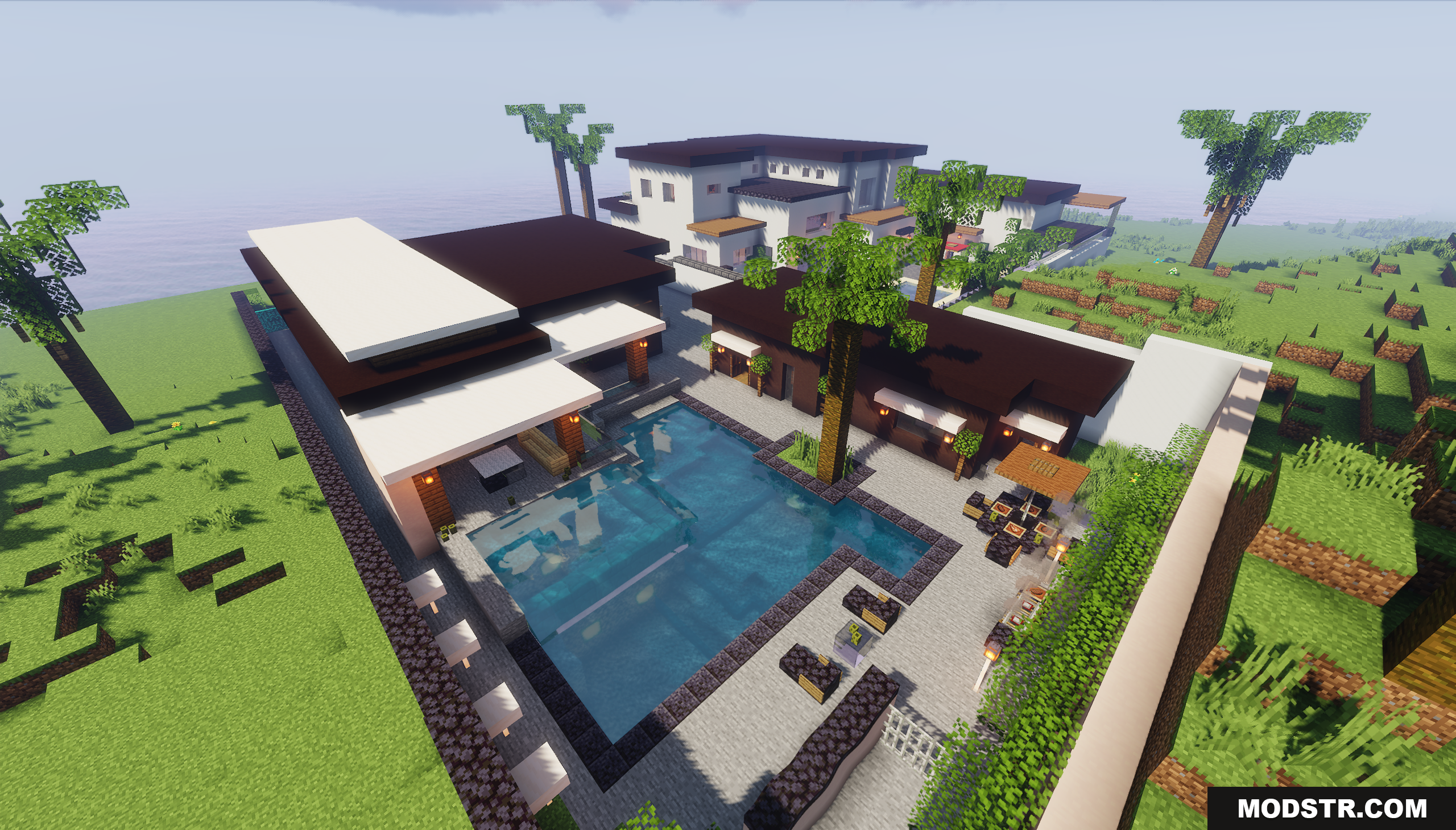 Modern house backyard featuring a large swimming pool and patio furniture