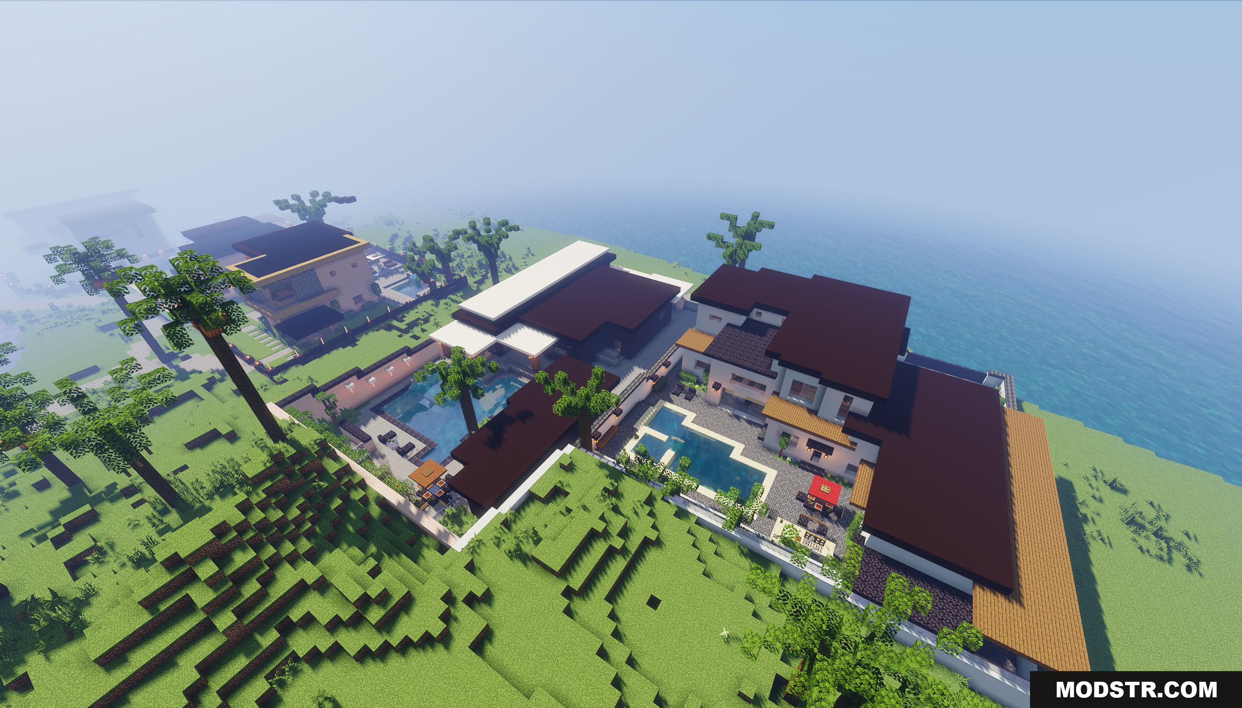 Aerial view of several modern houses with pools and yards