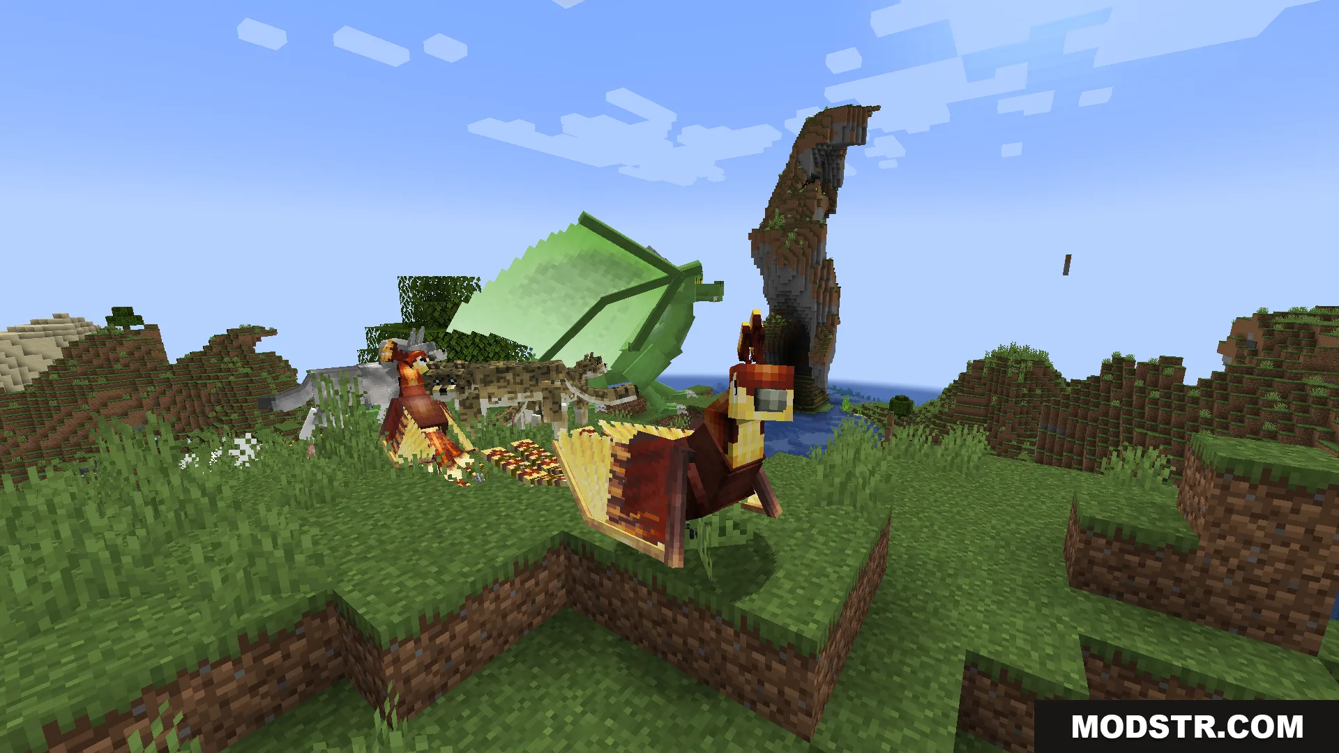 A green dragon and two phoenixes standing on a grassy hill in Minecraft