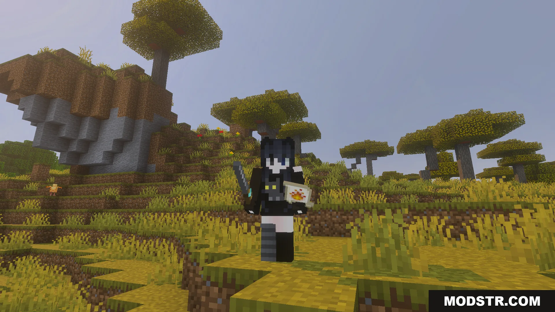 Minecraft player standing in a savanna biome holding a wand and fire scroll