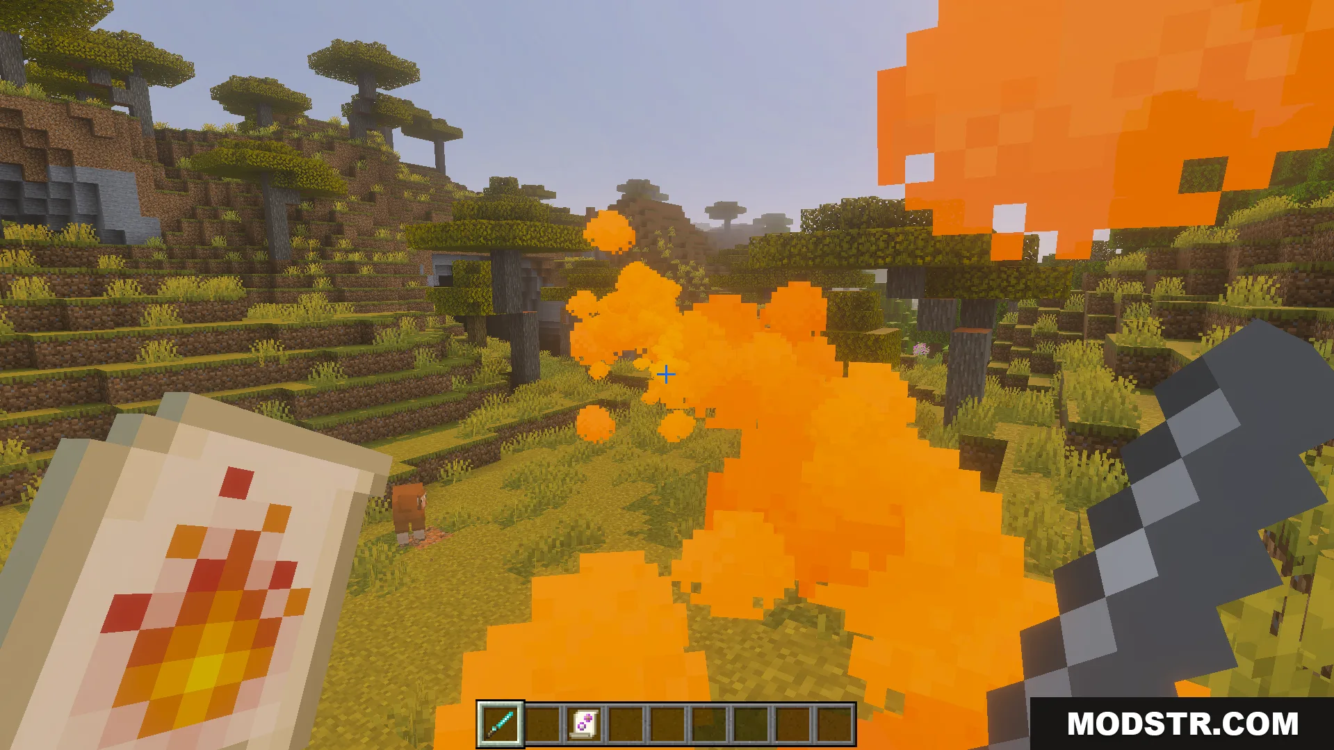 Casting a fire spell with orange particles in a savanna biome landscape