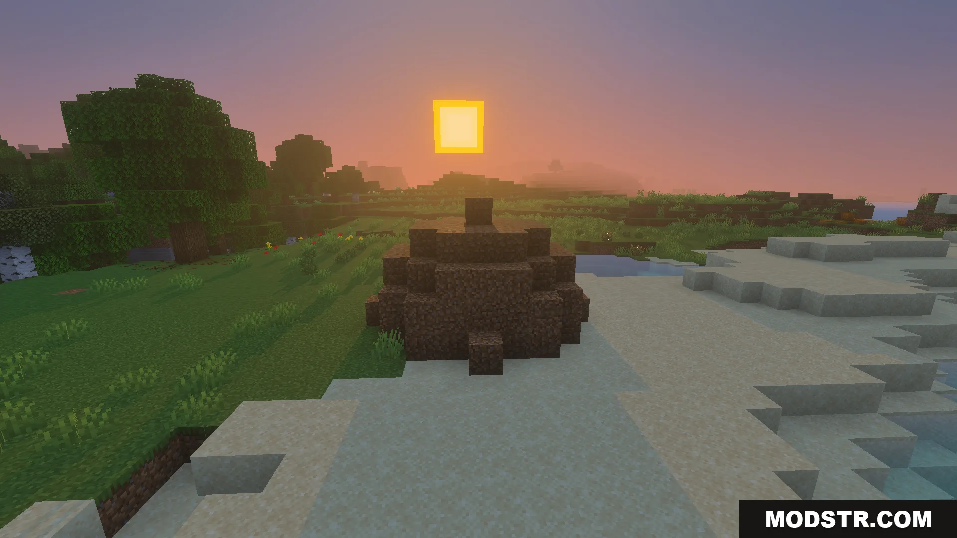 Not Enough TNT Addon Screenshot 7 A large pile of dirt blocks sitting on a sandy beach at sunset