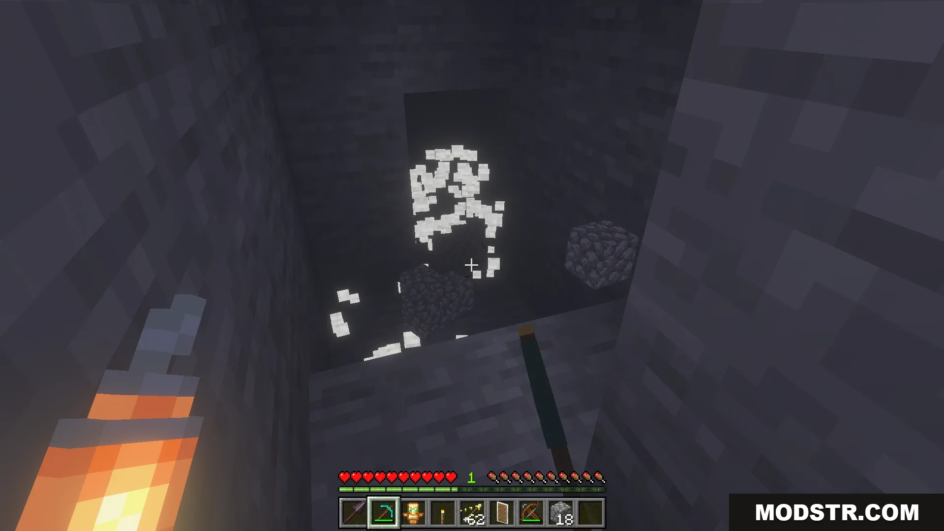 Offhand Addon Screenshot 6 Player holding a torch in the left hand while mining a cave