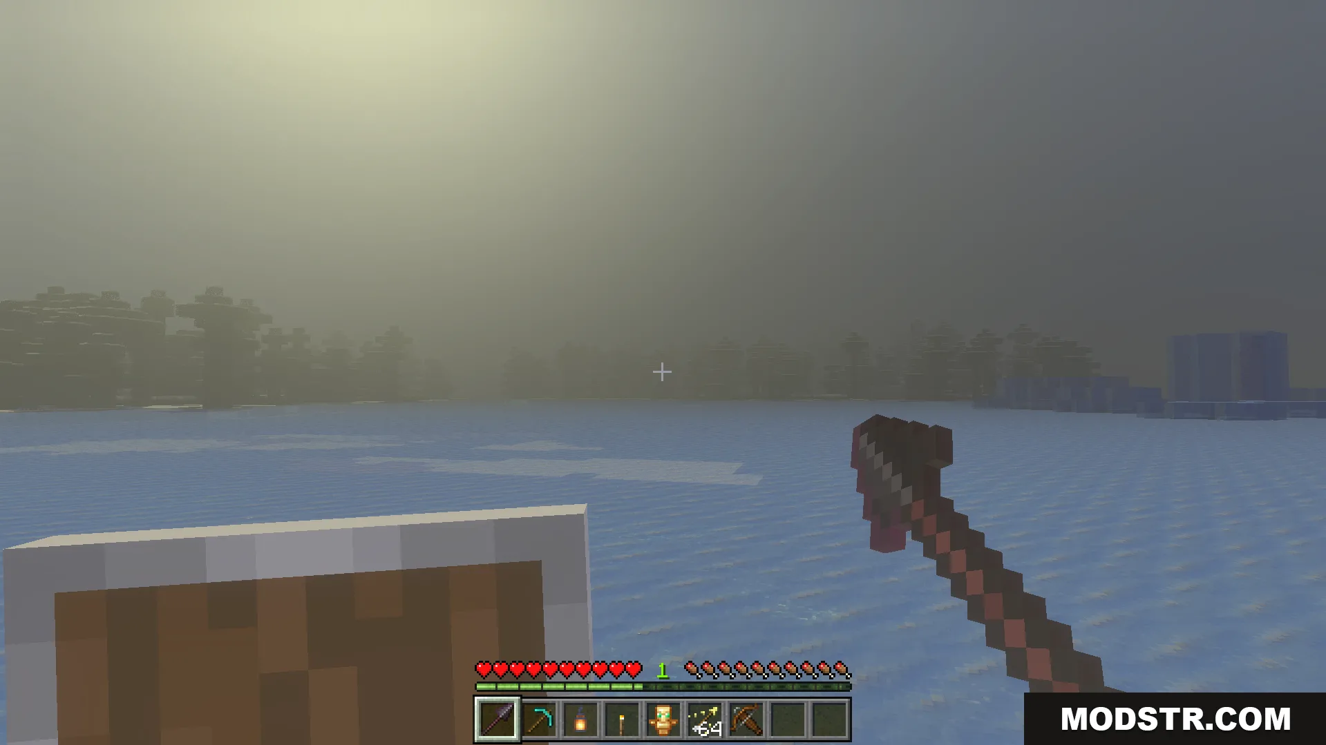 Offhand Addon Screenshot 4 Player holding a shield in the offhand while exploring a snowy biome