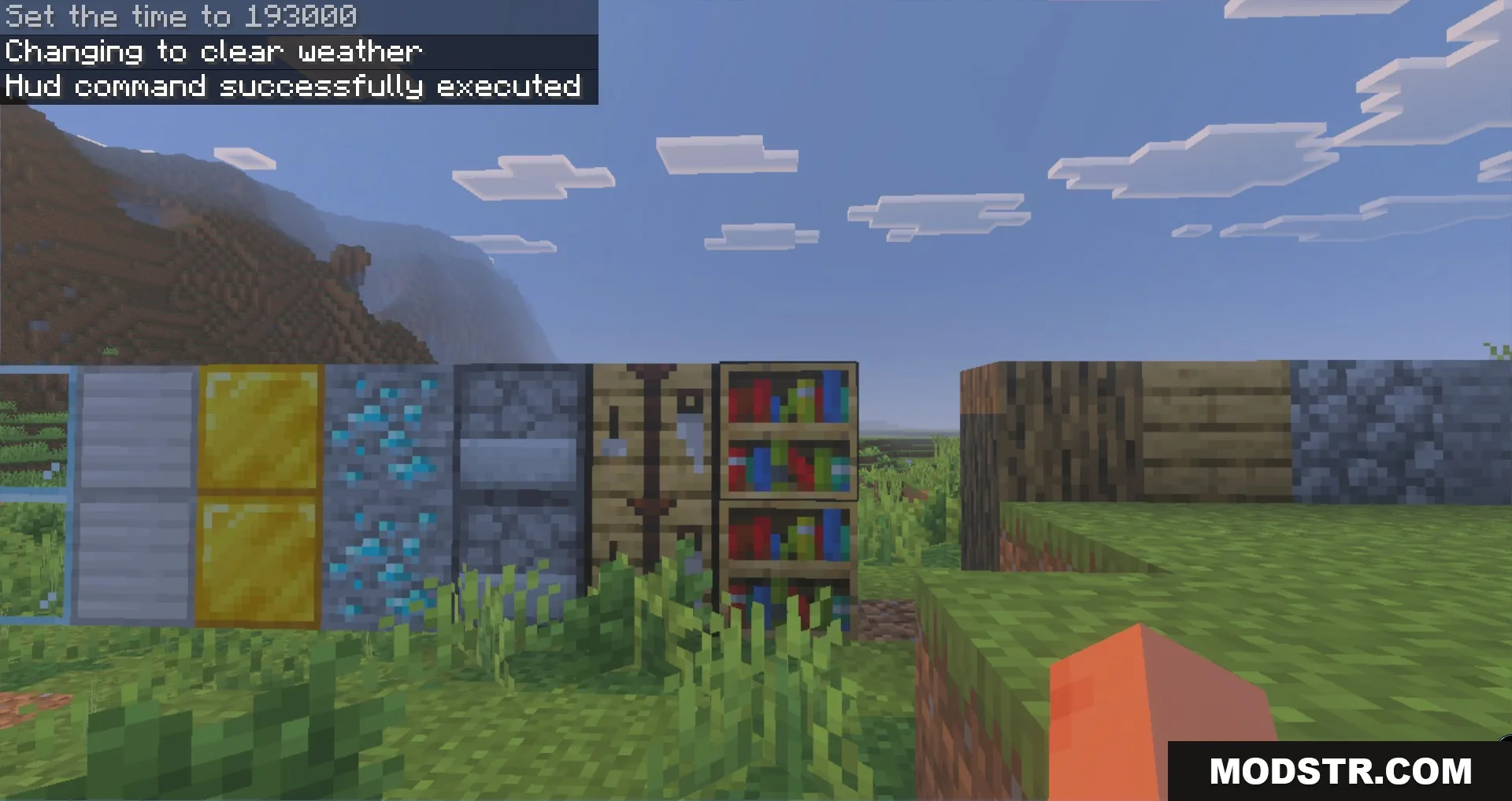 Player looking at a row of resource blocks including diamond ore and bookshelf