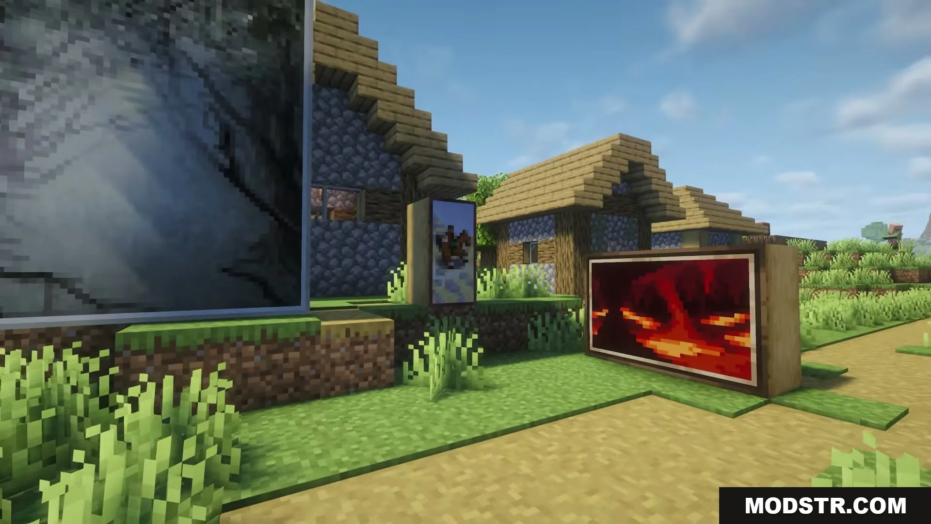 Several unique paintings displayed outside a village house in a Minecraft world