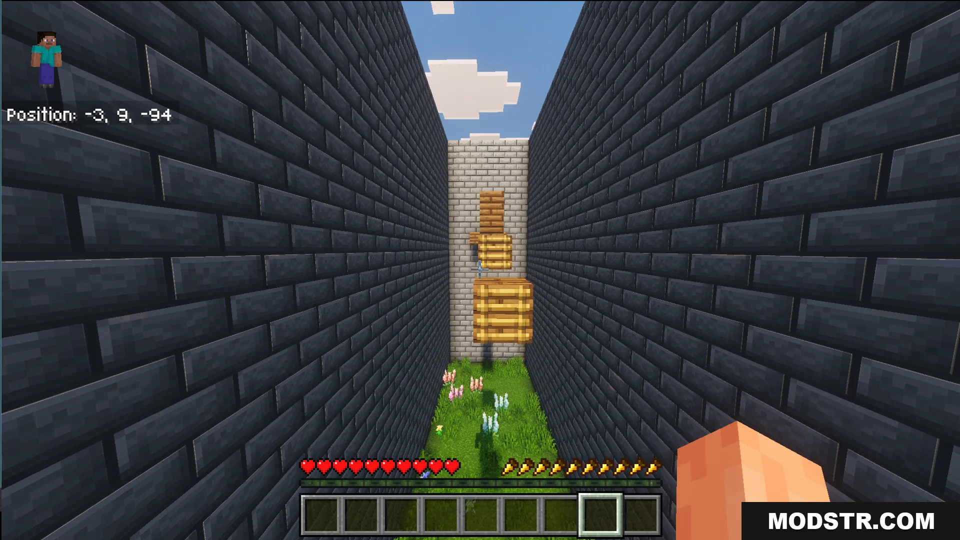 First person view of floating wooden blocks in a narrow stone brick hallway