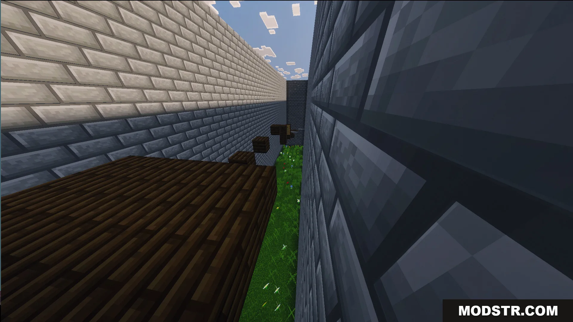 Easy parkour jumps inside a narrow stone brick corridor over a grassy floor
