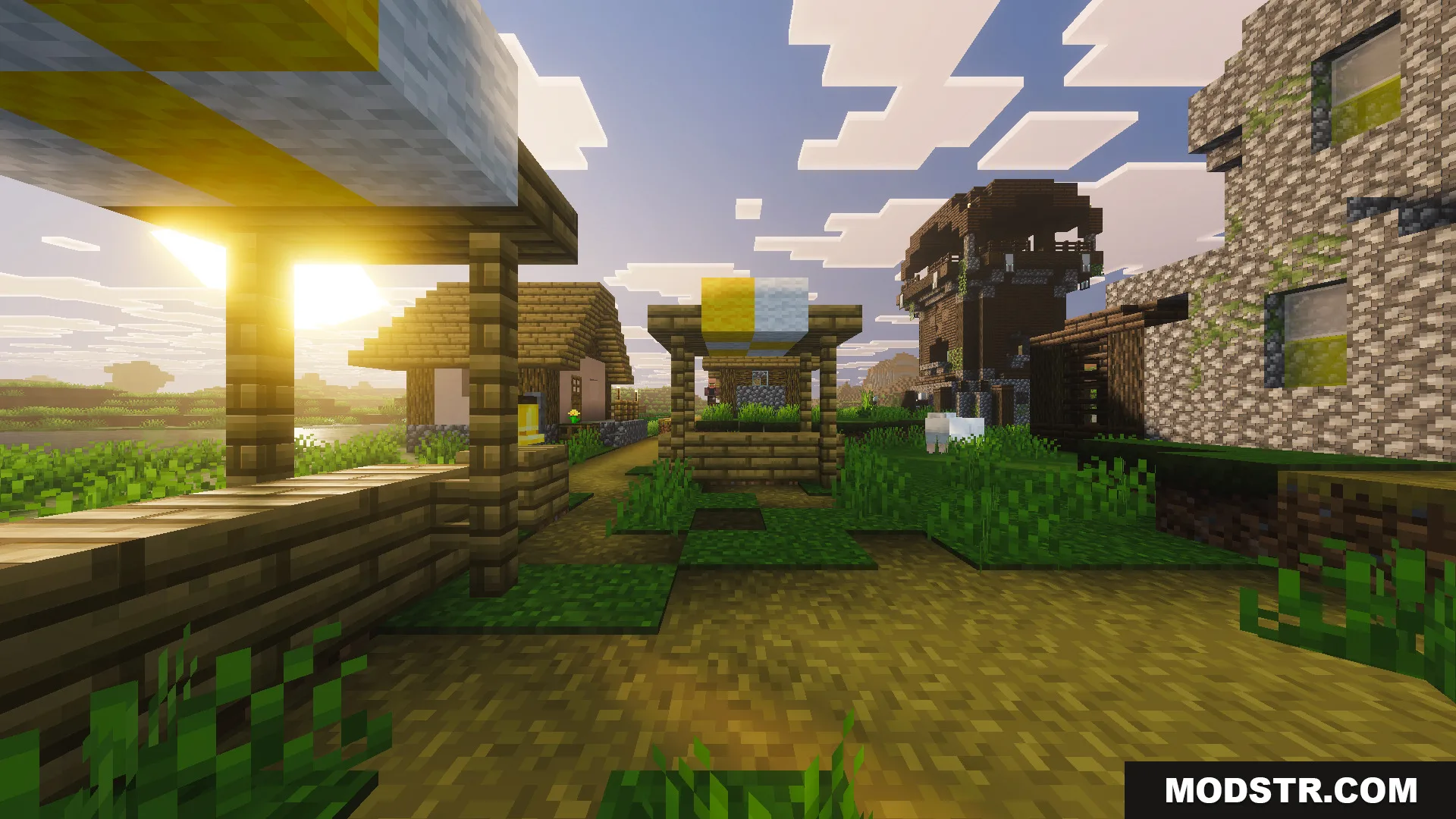 Part II OP Tool Smith Mod Map Screenshot 10 Scenic view of a custom village with a pillager outpost nearby at sunset