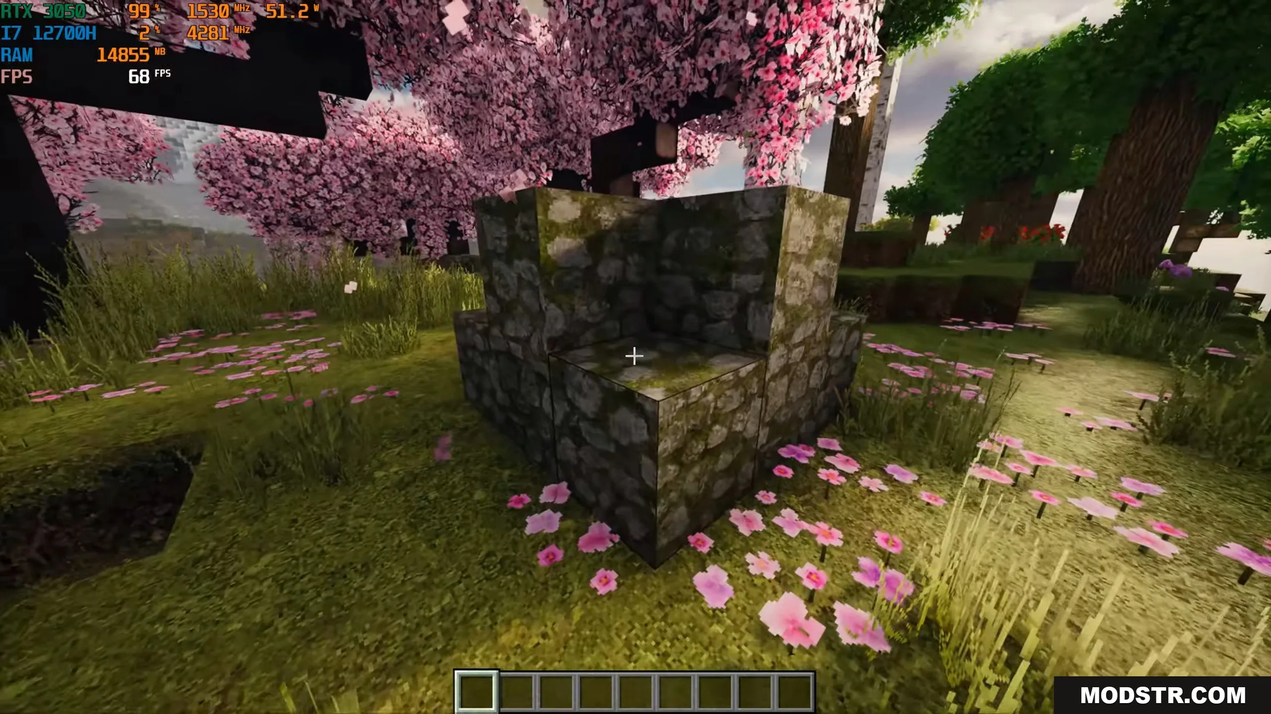 Photorealistic mossy cobblestone blocks placed in a vibrant cherry blossom forest biome
