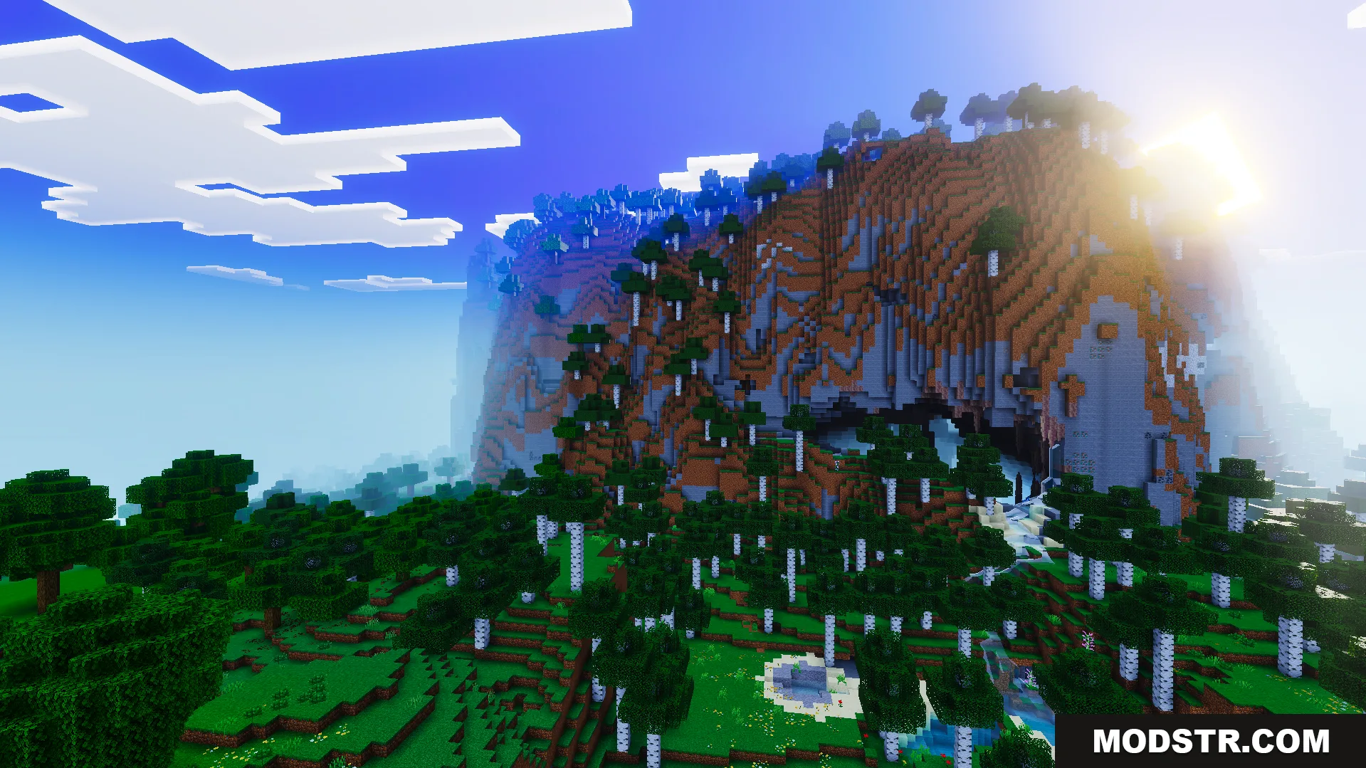 Realism Visuals Shader Screenshot 4 Bright orange sunset lighting shines over a large mountain and birch forest