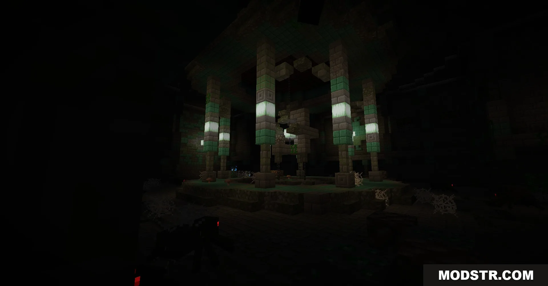 Dark interior of a monument with glowing froglights and stone pillars with cobwebs