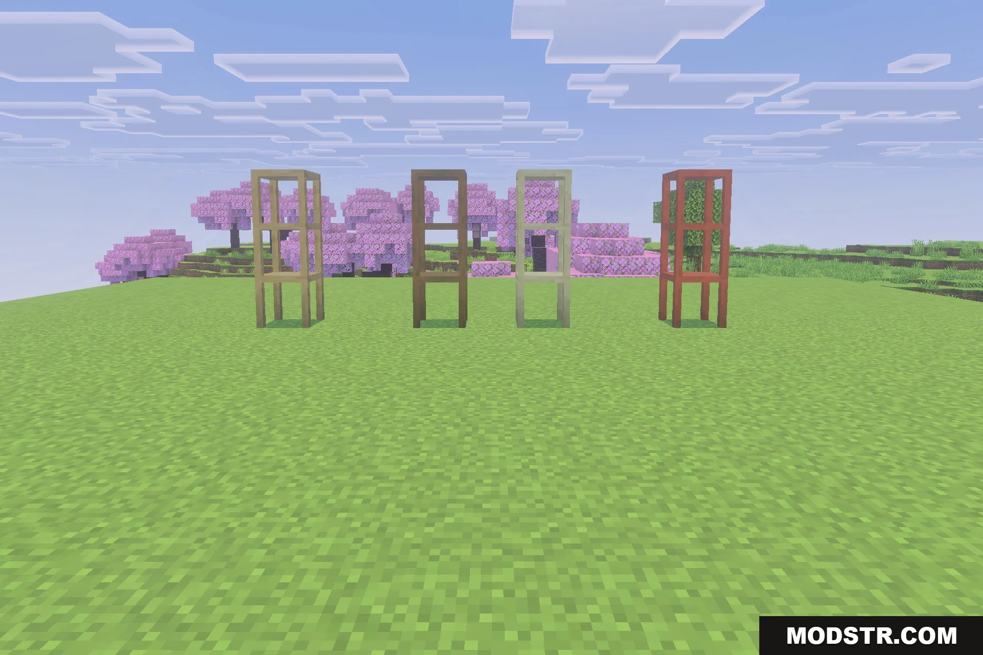 Four wooden storage shelves standing in a field with cherry blossom trees