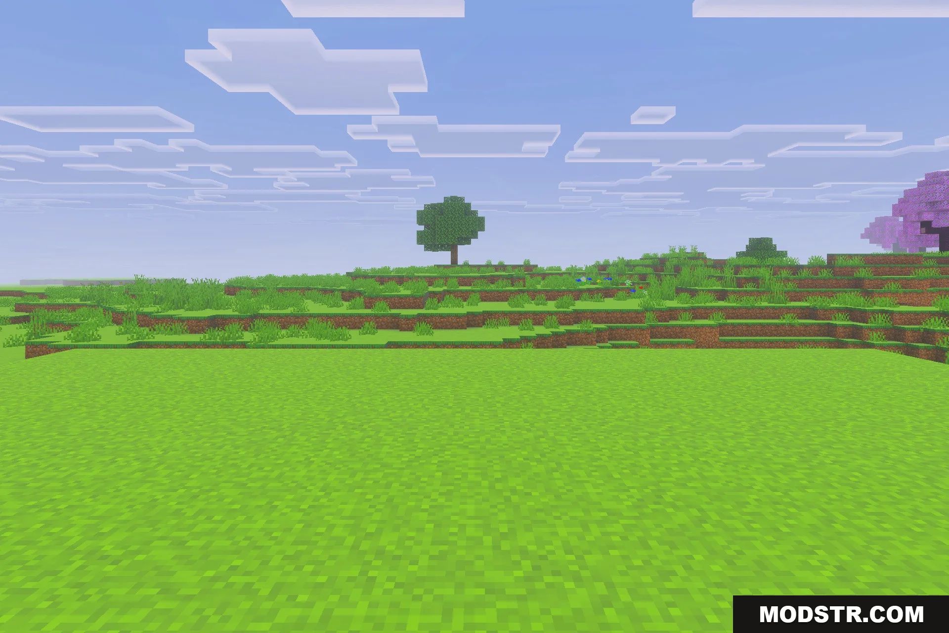 Saturated for Bedrock Edition Texture Pack Screenshot 3 Vibrant green landscape with a single tree under a bright blue sky