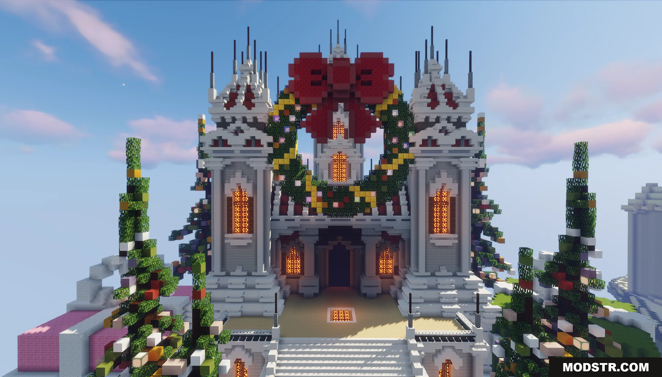 A grand building in Minecraft decorated with a large wreath and red bow