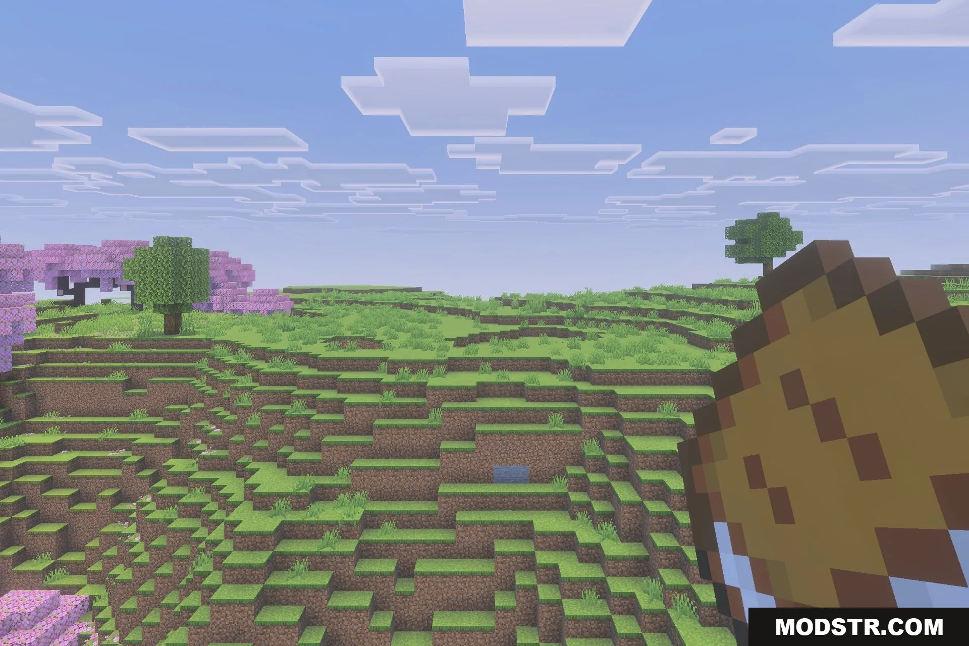 Simple Backpack Achievement Friendly No Lag Addon Screenshot 3 A player holds a Simple Backpack item while exploring a cherry blossom biome