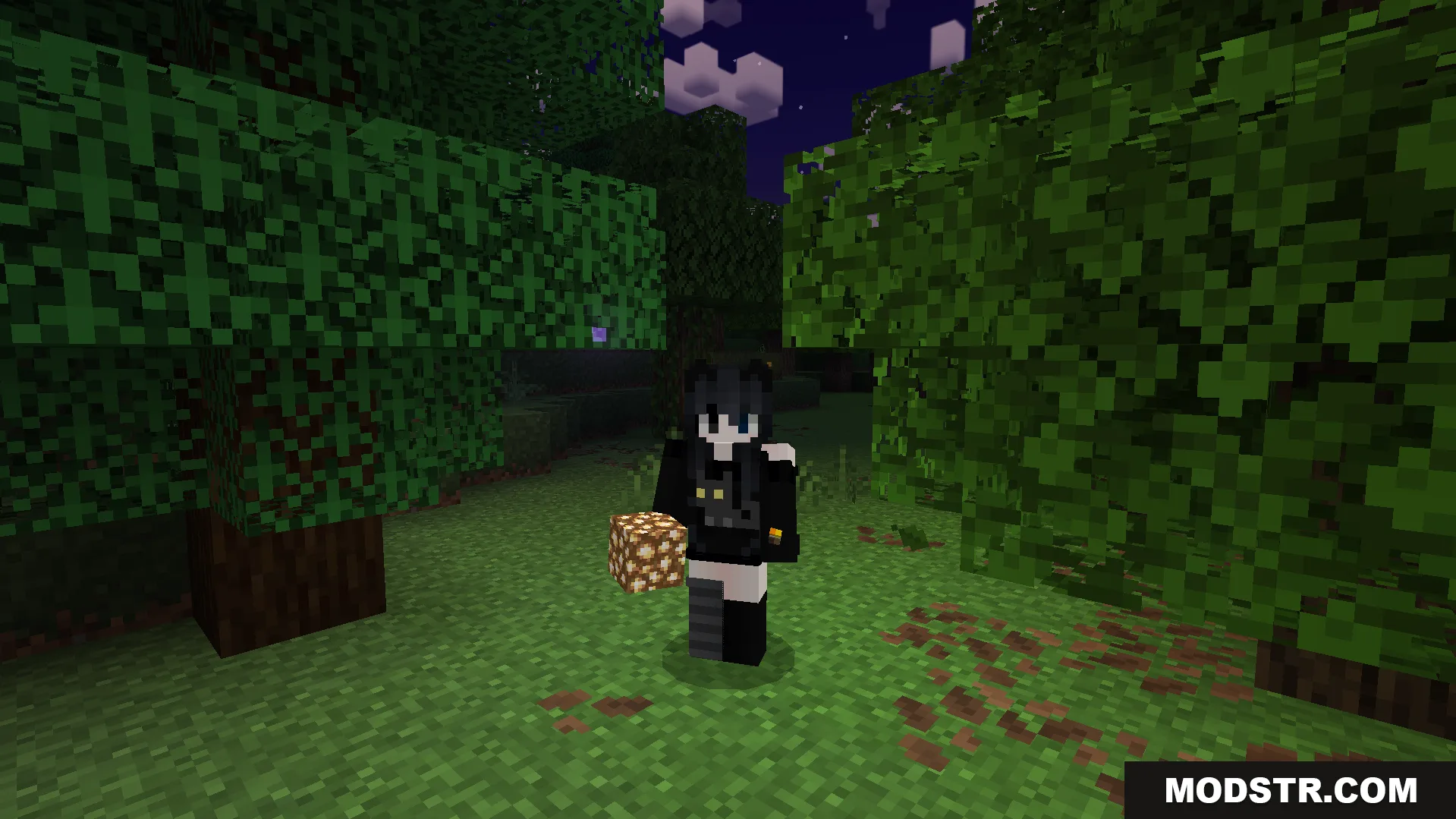 Player holding a glowstone block to light up the dark path