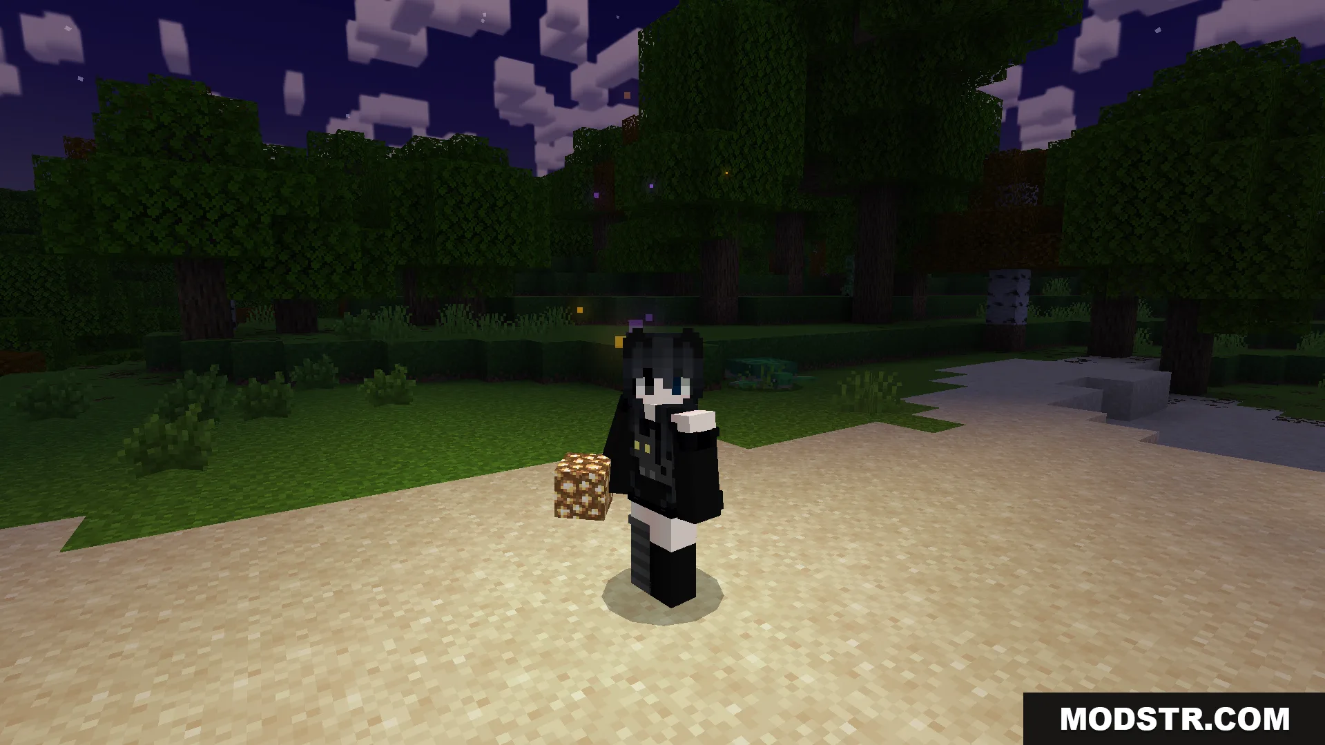 Player holding a glowstone block at night near a forest