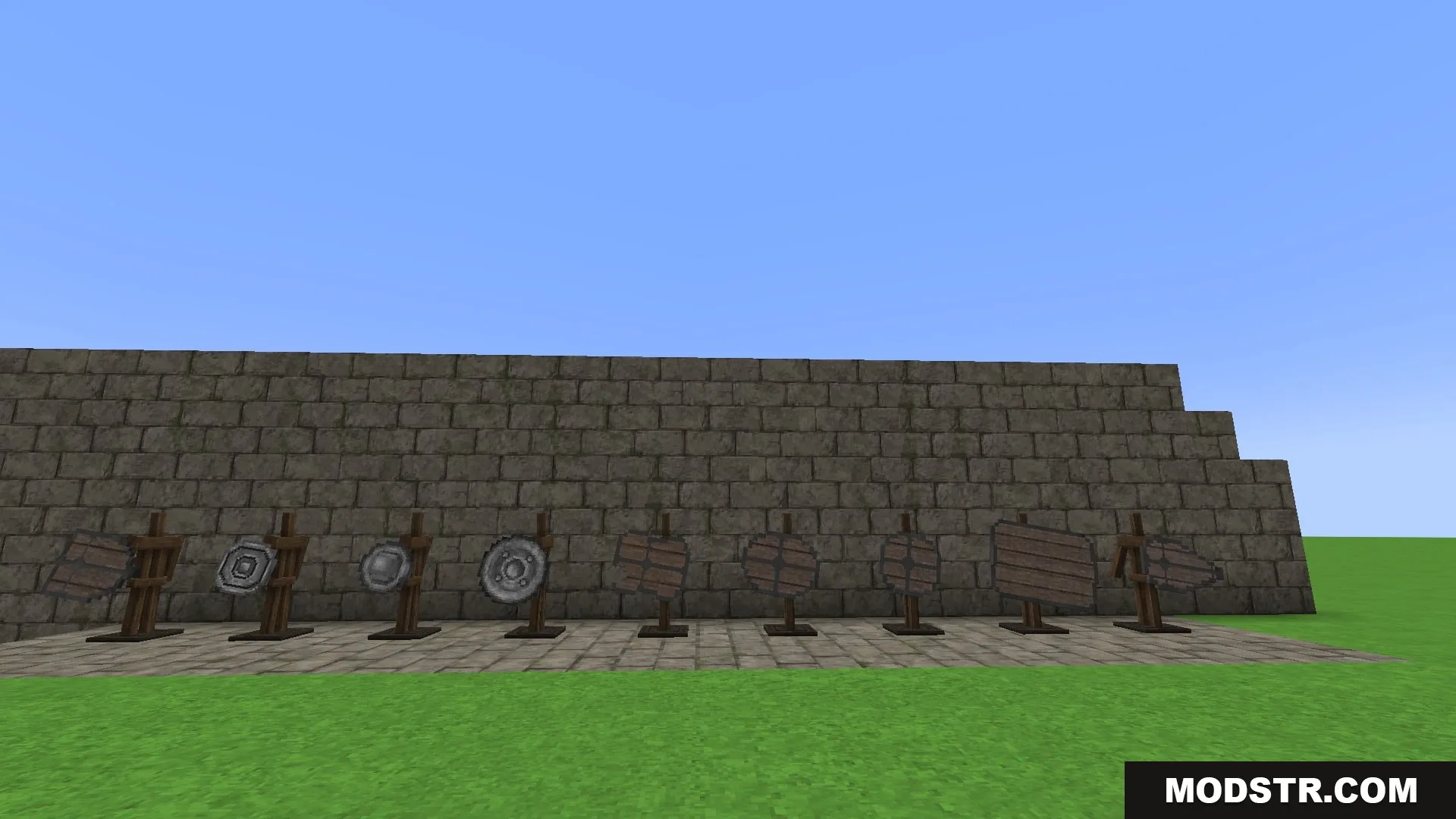 Steel Crown Heritage Resource Pack Screenshot 7 Various medieval shields displayed on wooden stands against a stone wall