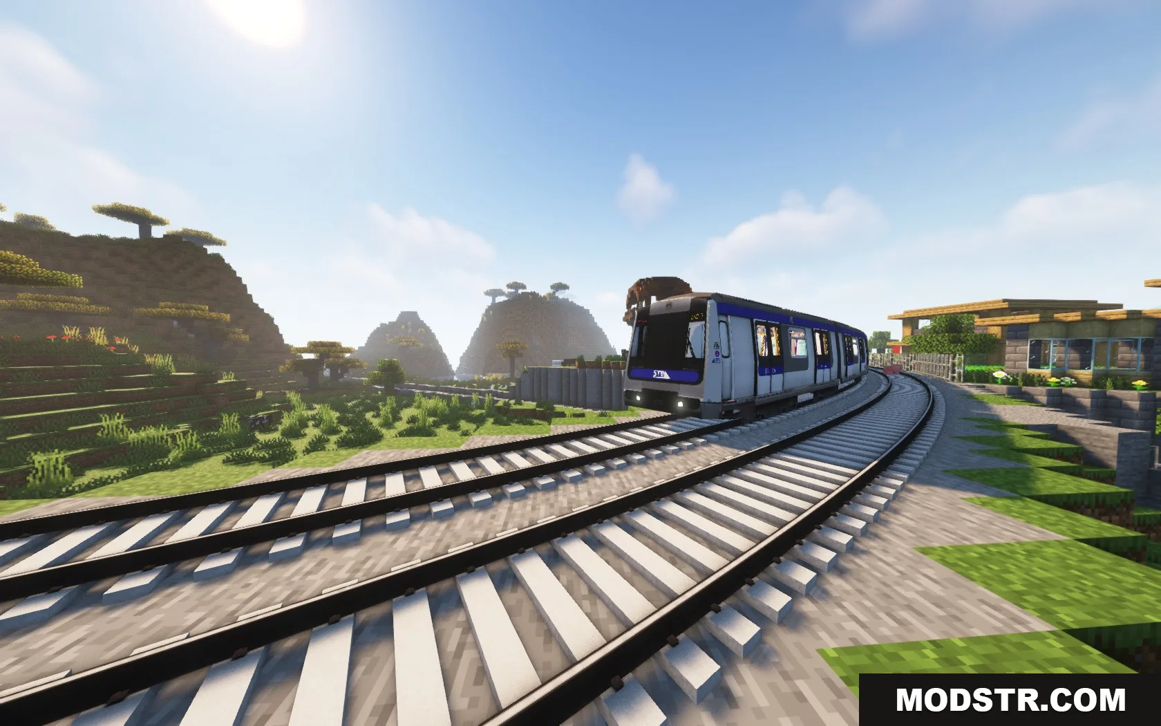 Steel Transit Blueprints Resource Pack Screenshot 5 A blue and white train traveling on curved tracks through a Minecraft savanna