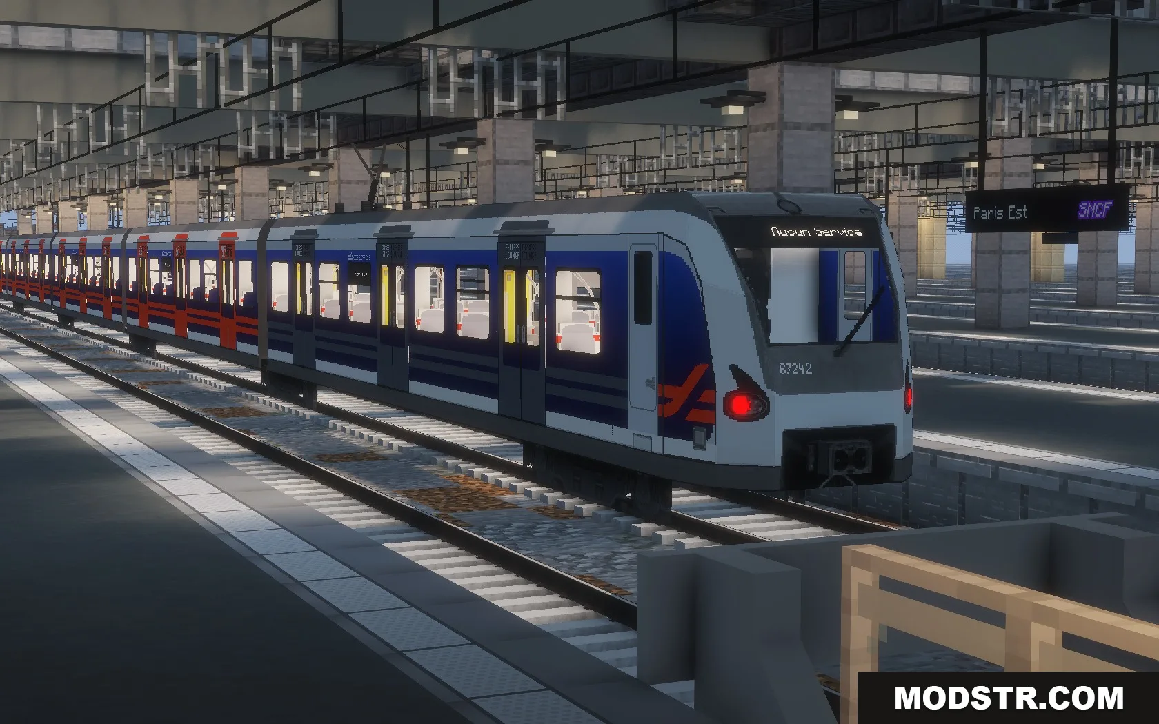 Steel Transit Blueprints Resource Pack Screenshot 4 A blue and white SNCF train stopped at a detailed Minecraft station platform