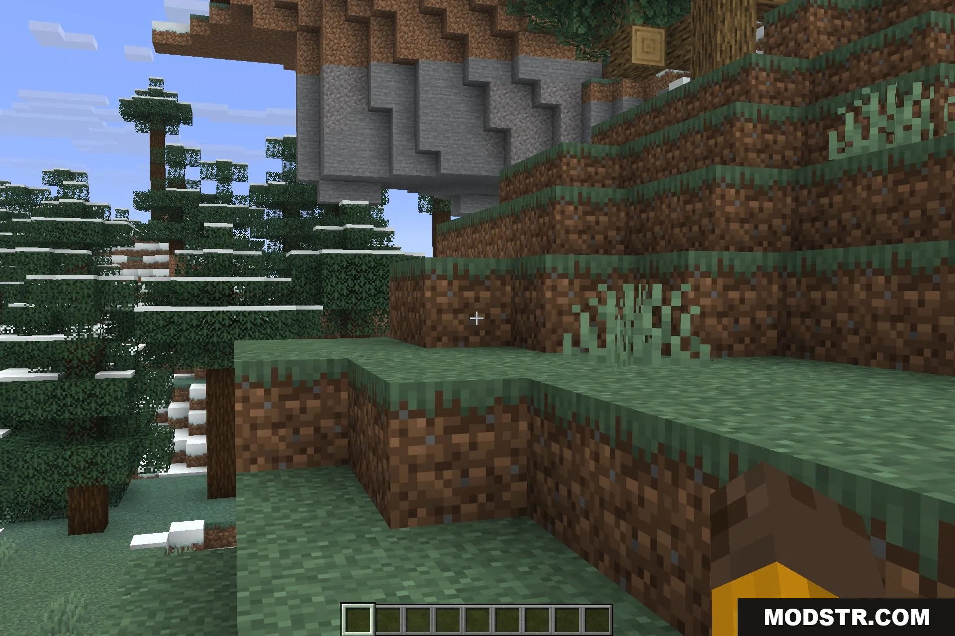A close view of a stone shelf set into a dirt terrace
