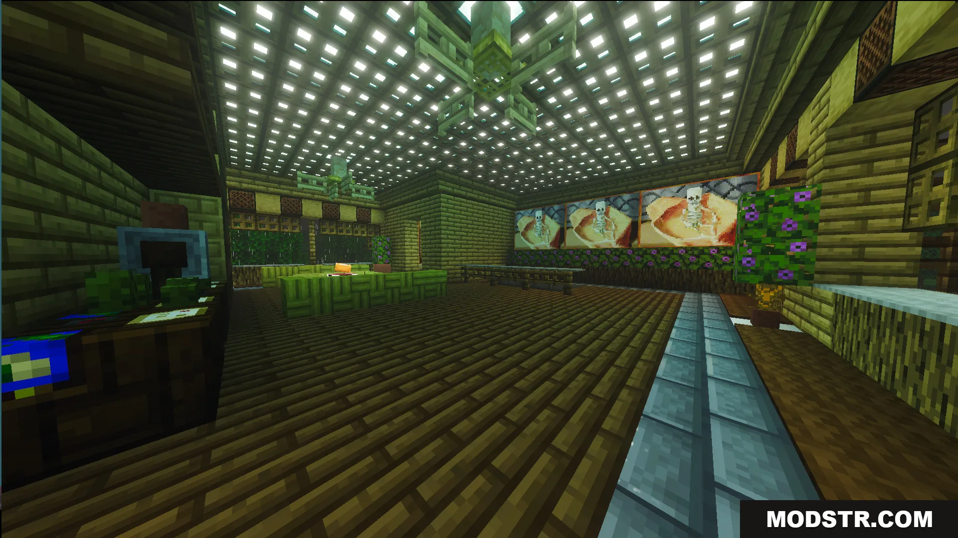 Spacious interior room with wooden floors and skeleton paintings on the wall