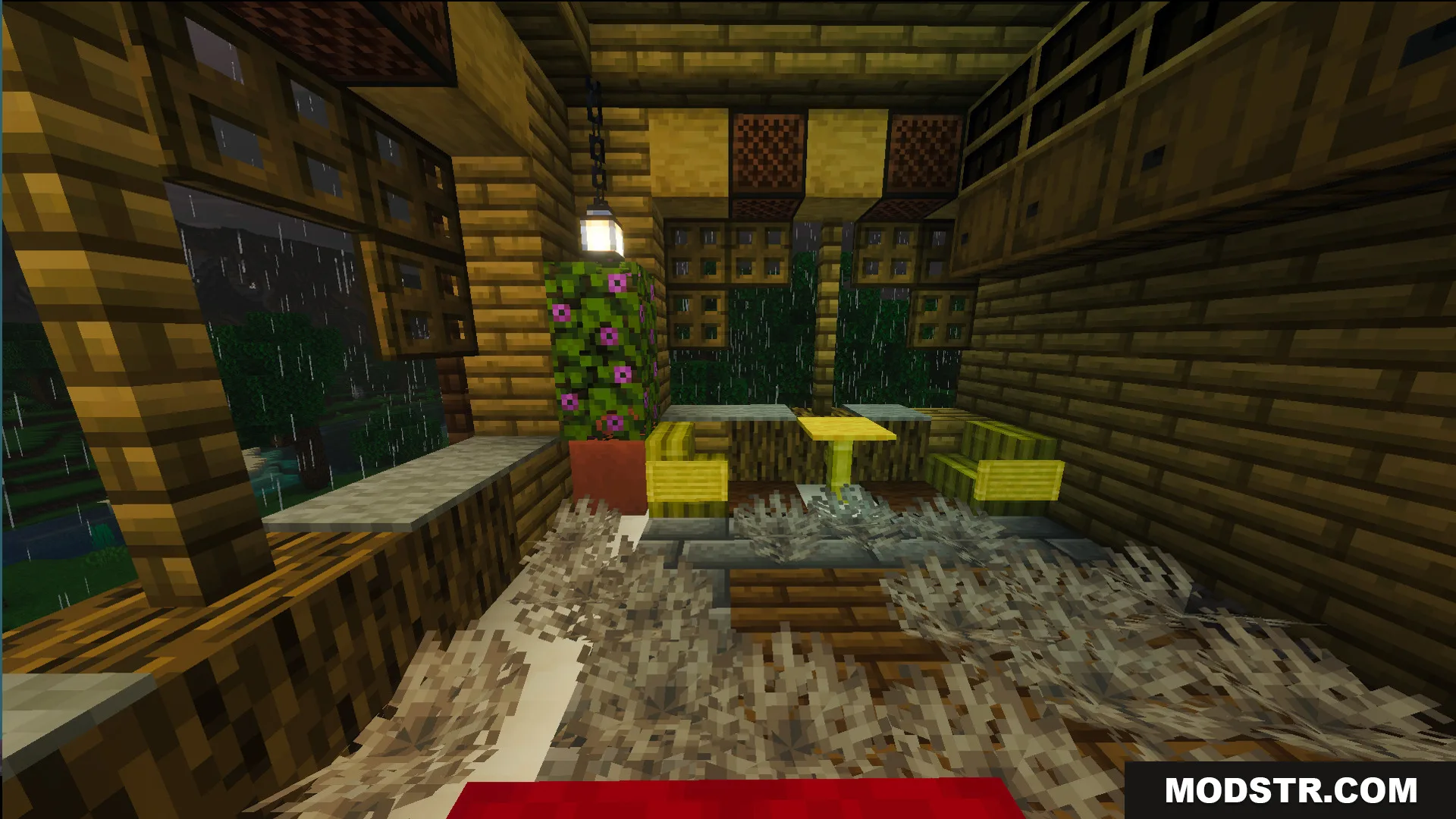 Small dining area with yellow chairs and a table inside the survival house