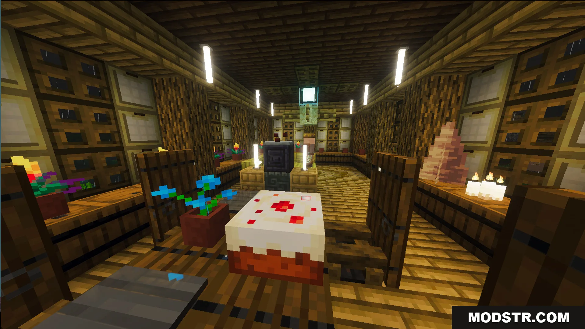 Interior of the Survival Filo House 20 Map with a cake and wooden chairs