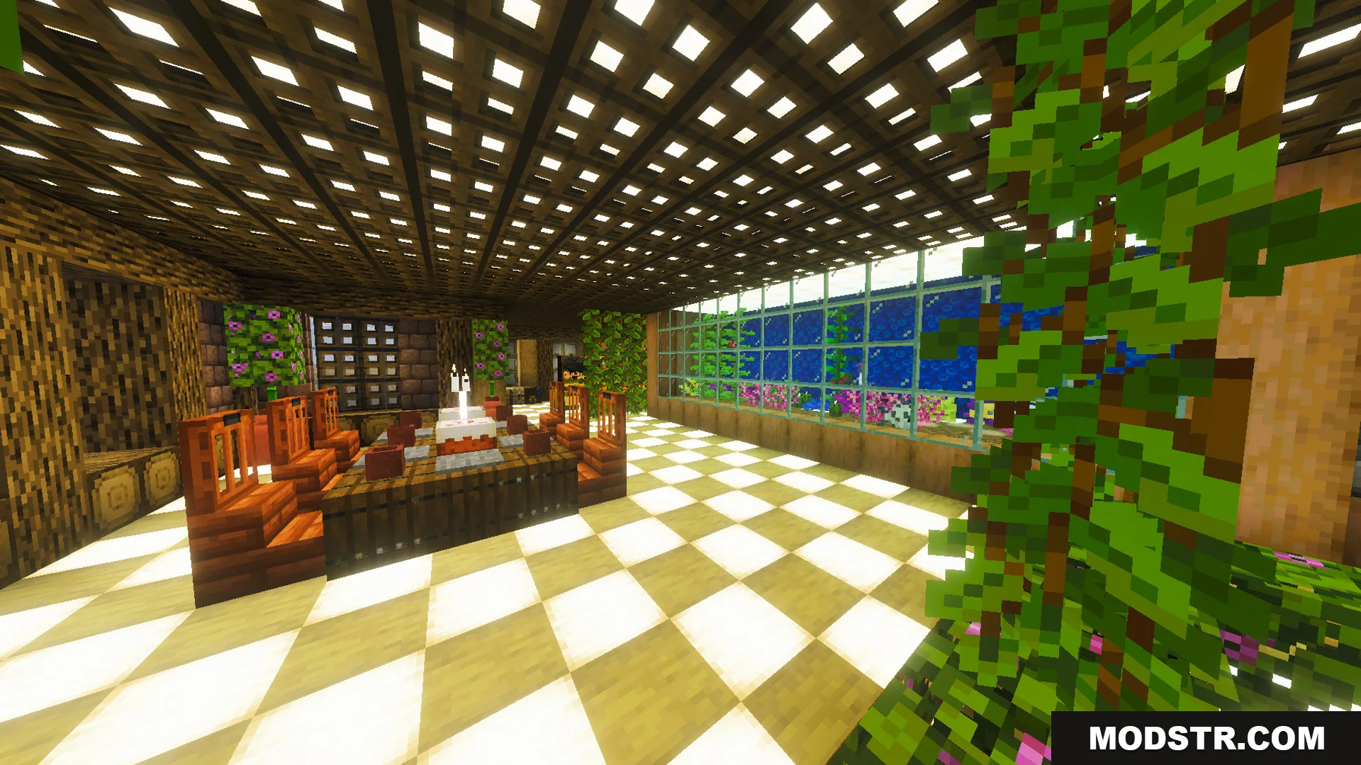 A dining room with a large aquarium and bamboo furniture