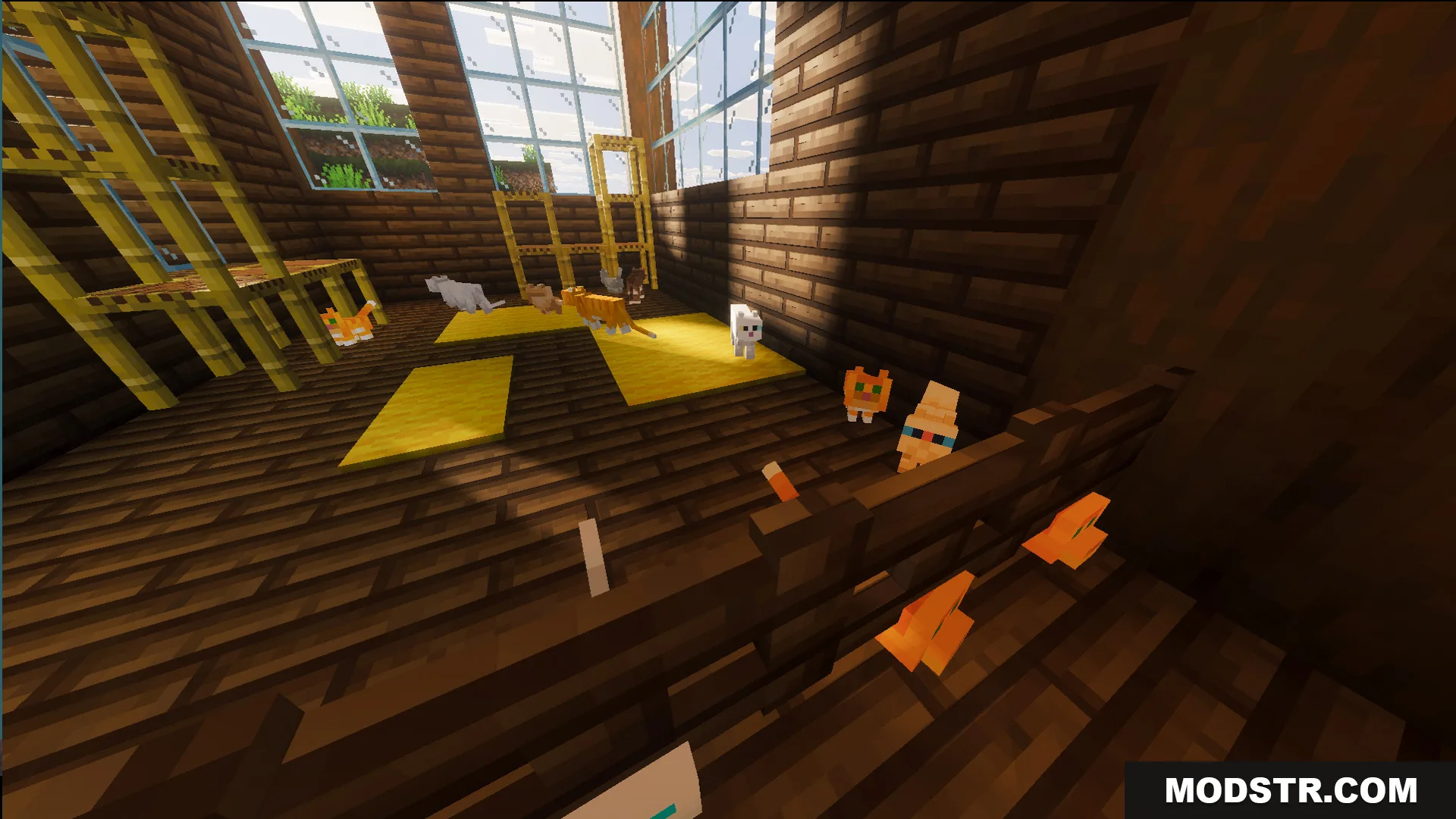 Survival Log Cabin House 86 Map Screenshot 6 Multiple cats playing on yellow carpets inside a wooden room with tall bamboo scaffolding