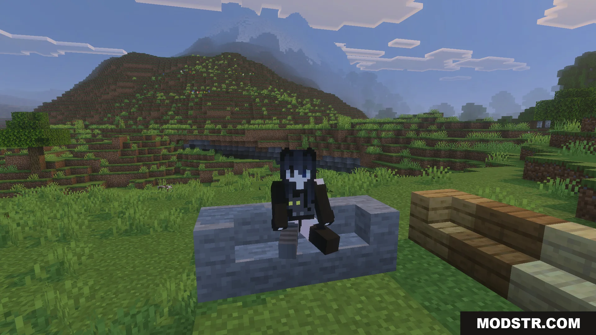 Take a Seat Addon Screenshot 7 Minecraft player sitting on a stone slab bench with mountains in the background