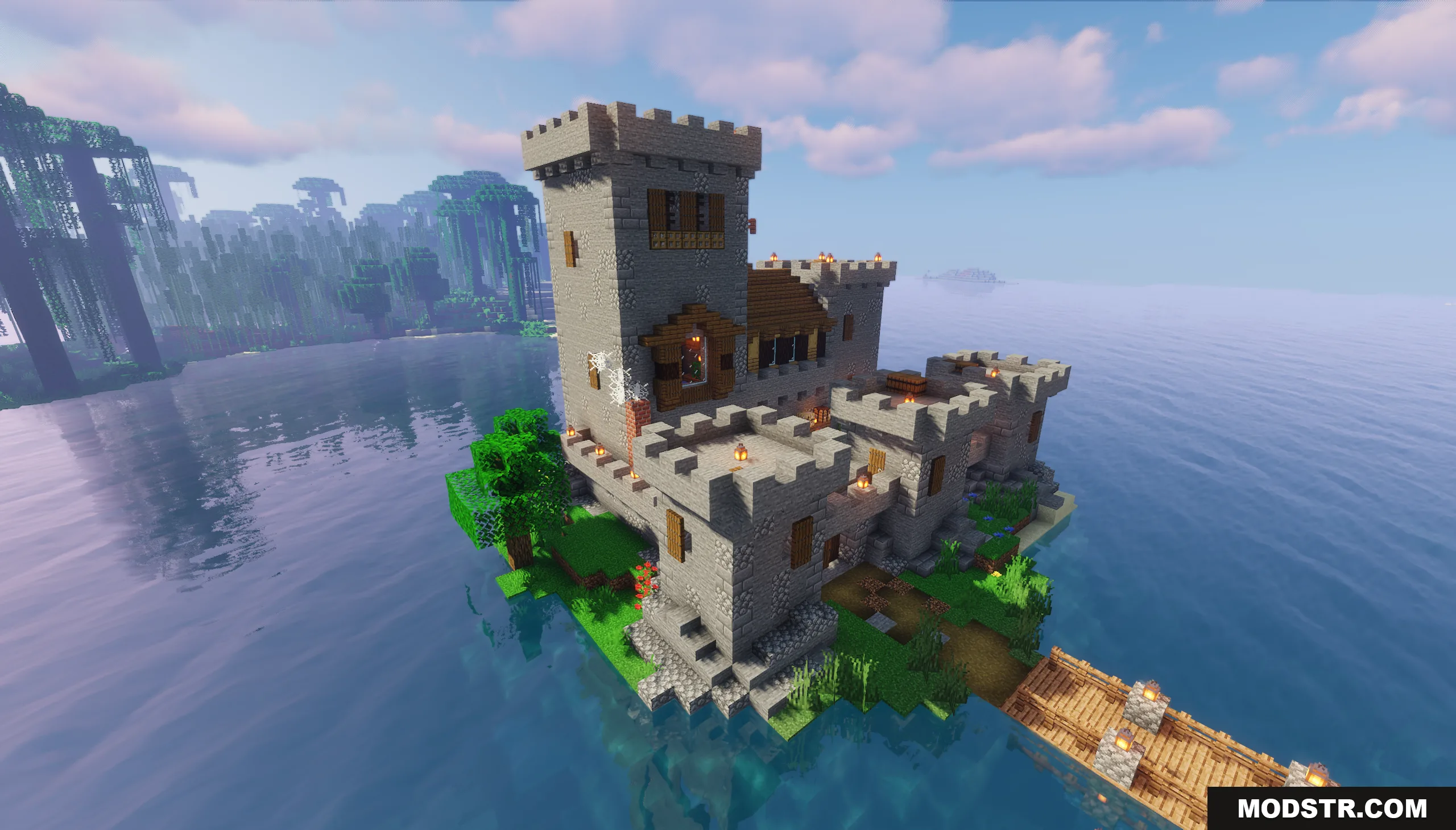 Aerial view of a large stone fortress situated on a small green island