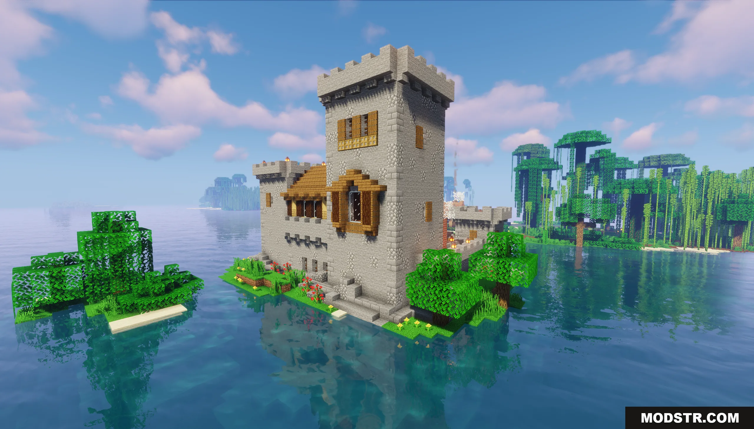 A large medieval stone fortress built on a small island in the ocean