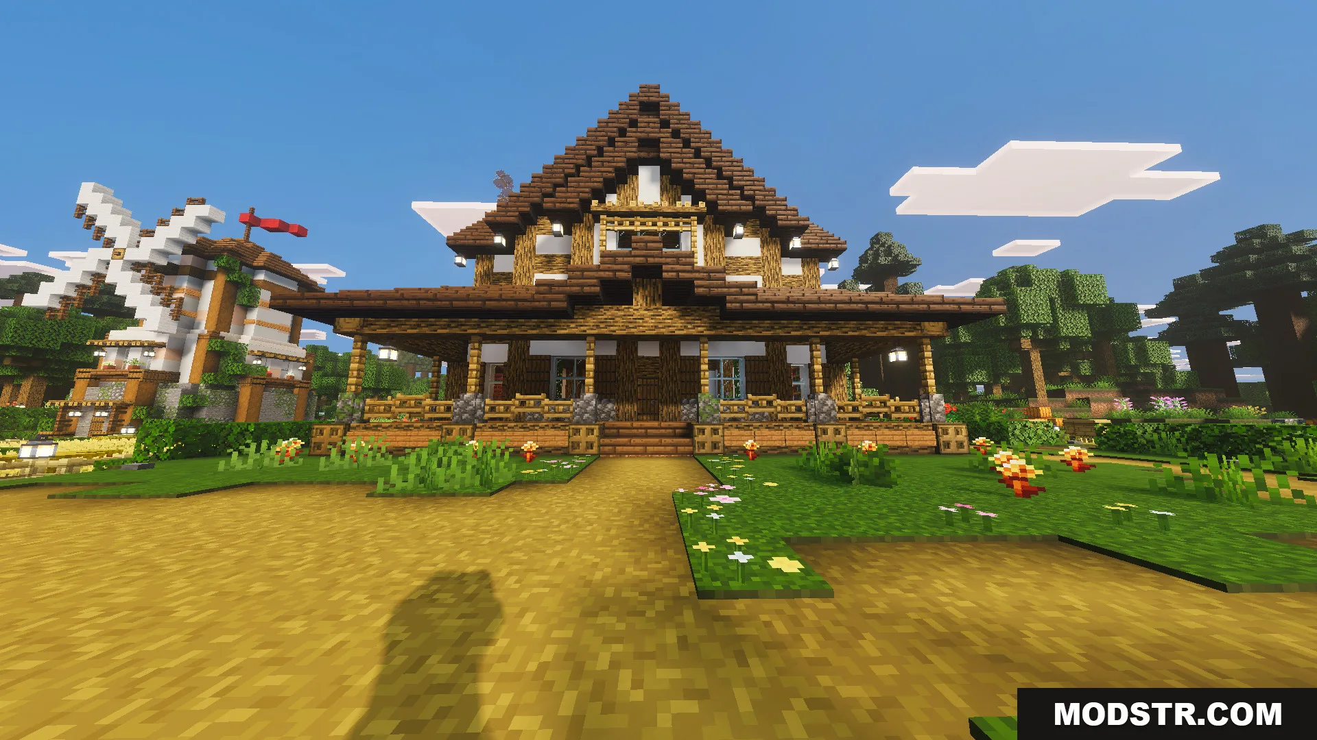 Tiny Takeover Farmstead Map Screenshot 2 Front view of a large wooden farmhouse with a nearby windmill