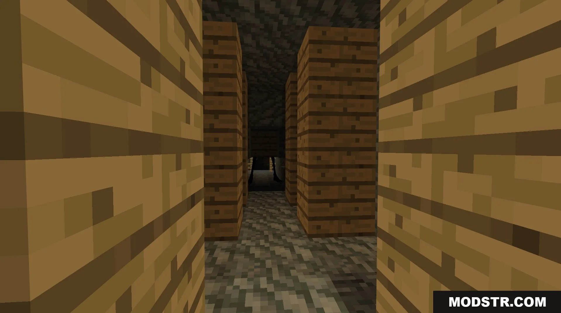 A scary creature watches from the shadows of a dark wooden structure